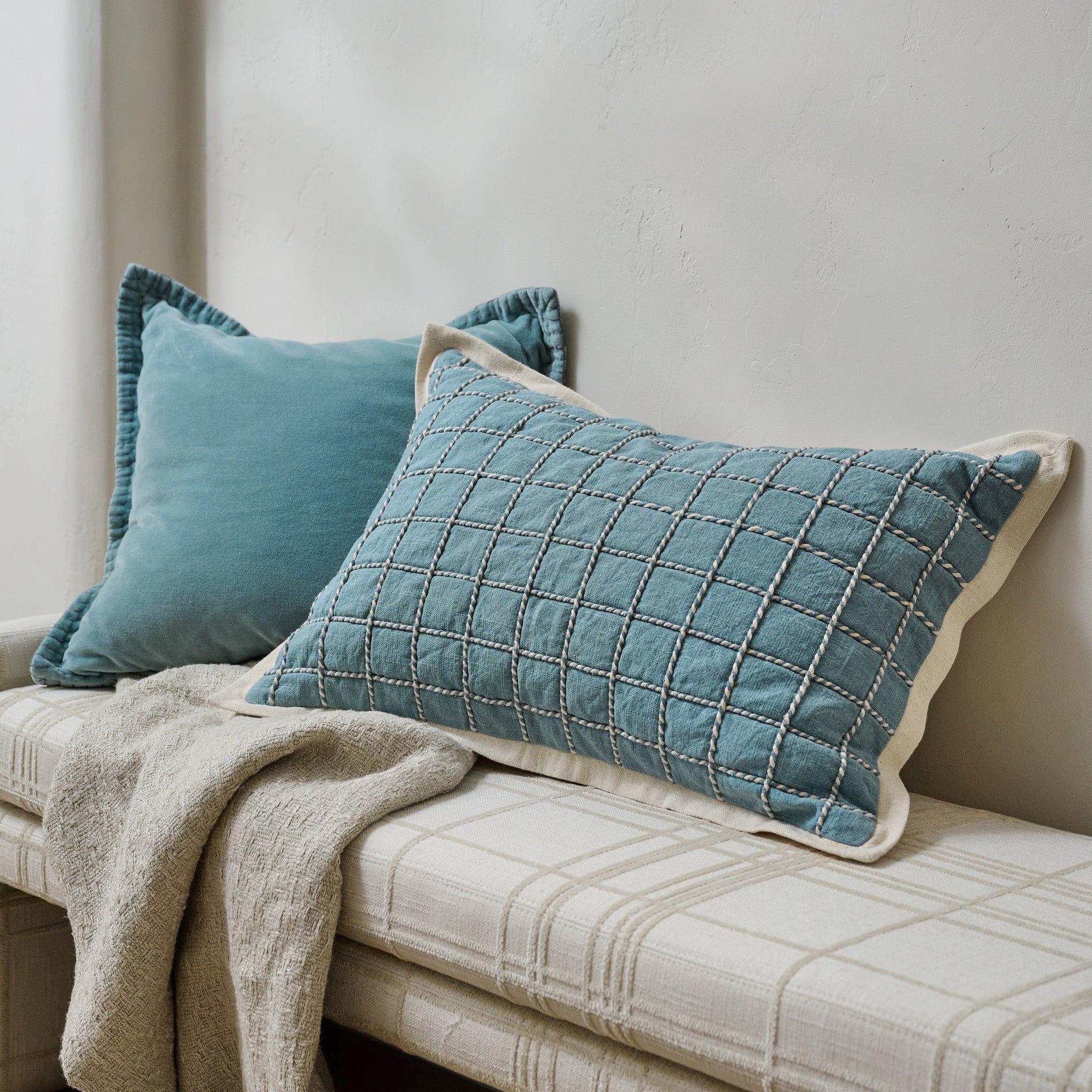 Saylor Grid Printed Lumbar Pillow shown on entryway bench styled