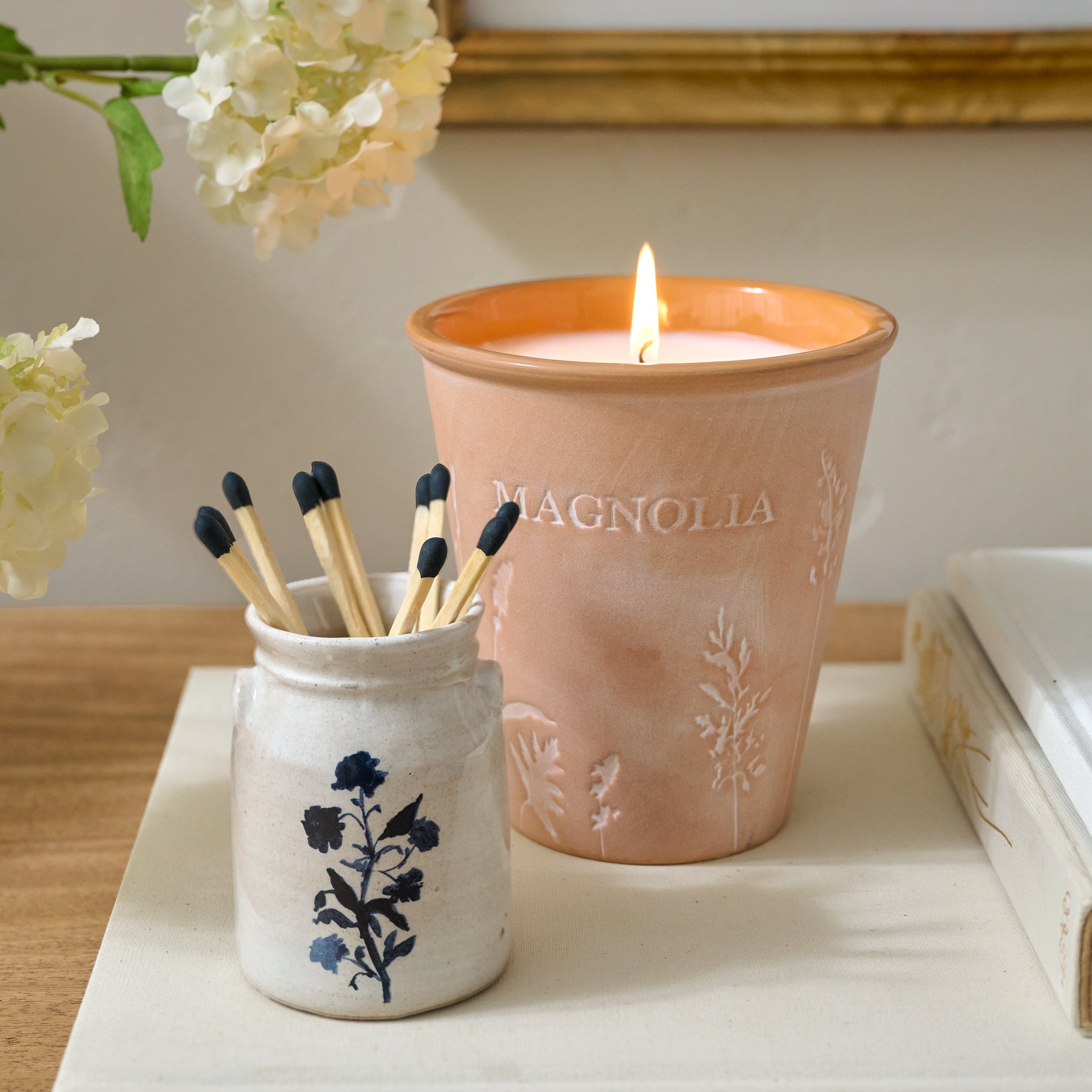 Lila Floral Mini Crock shown holding matches