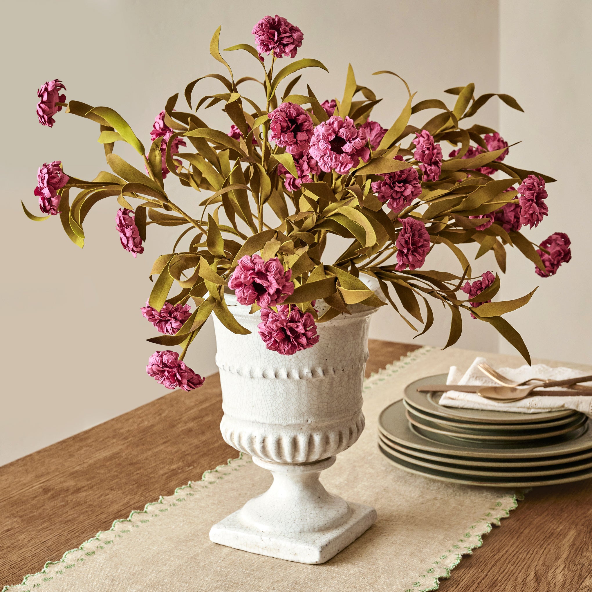 Purple Wildflower Bush shown in vase on dining room table