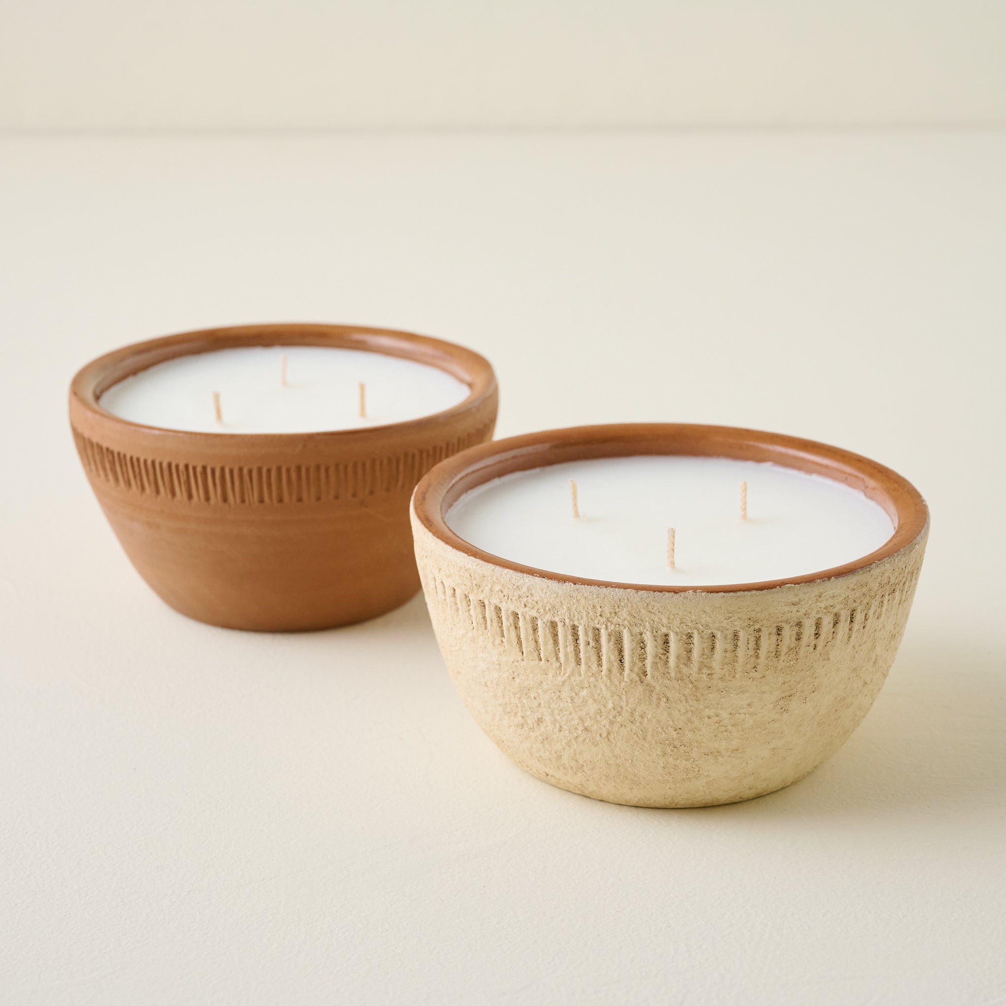 Magnoliass Daybreak Rustic Bowl Candle shown with another rustic bowl candle