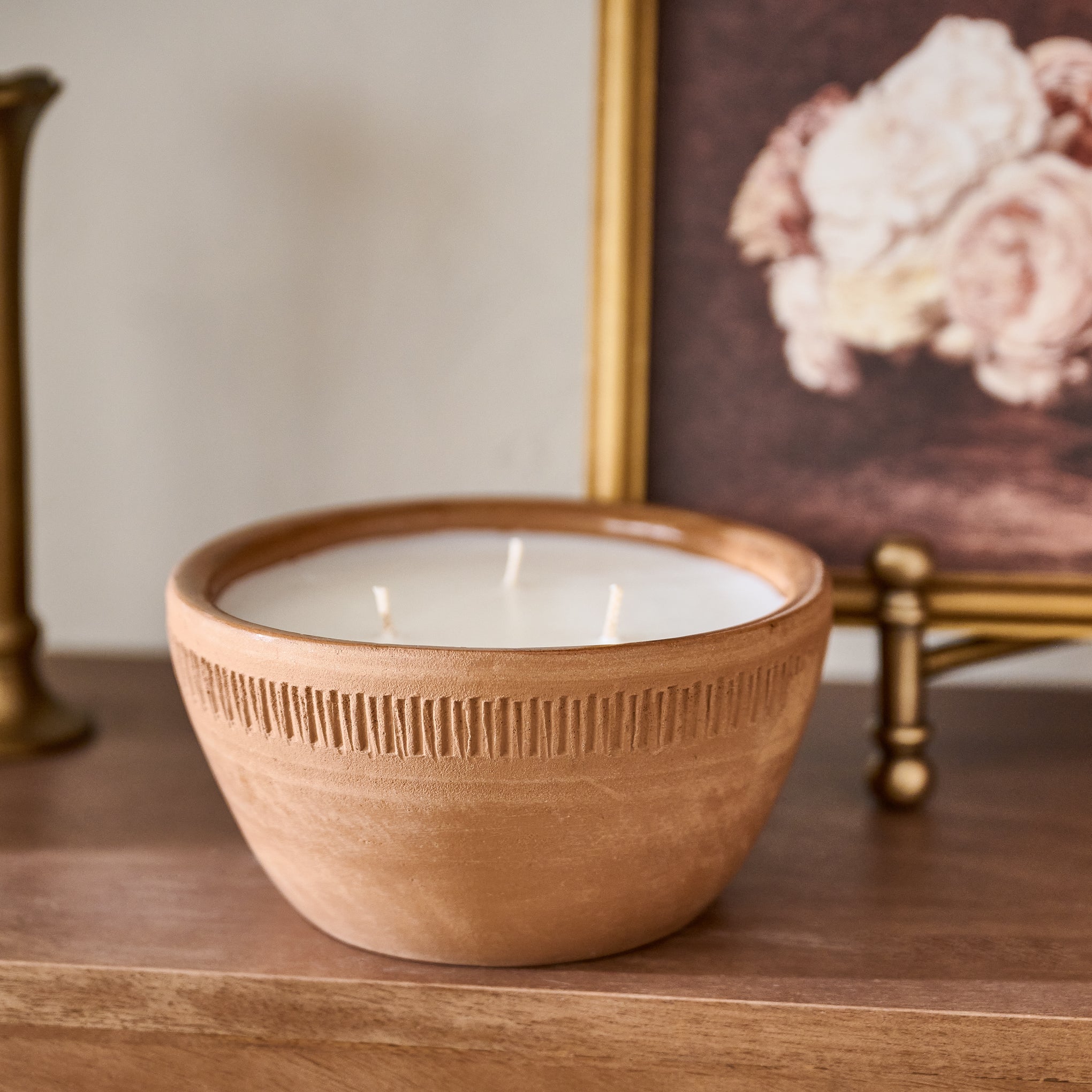 Magnoliass Greenhouse Rustic Bowl Candle shown on table