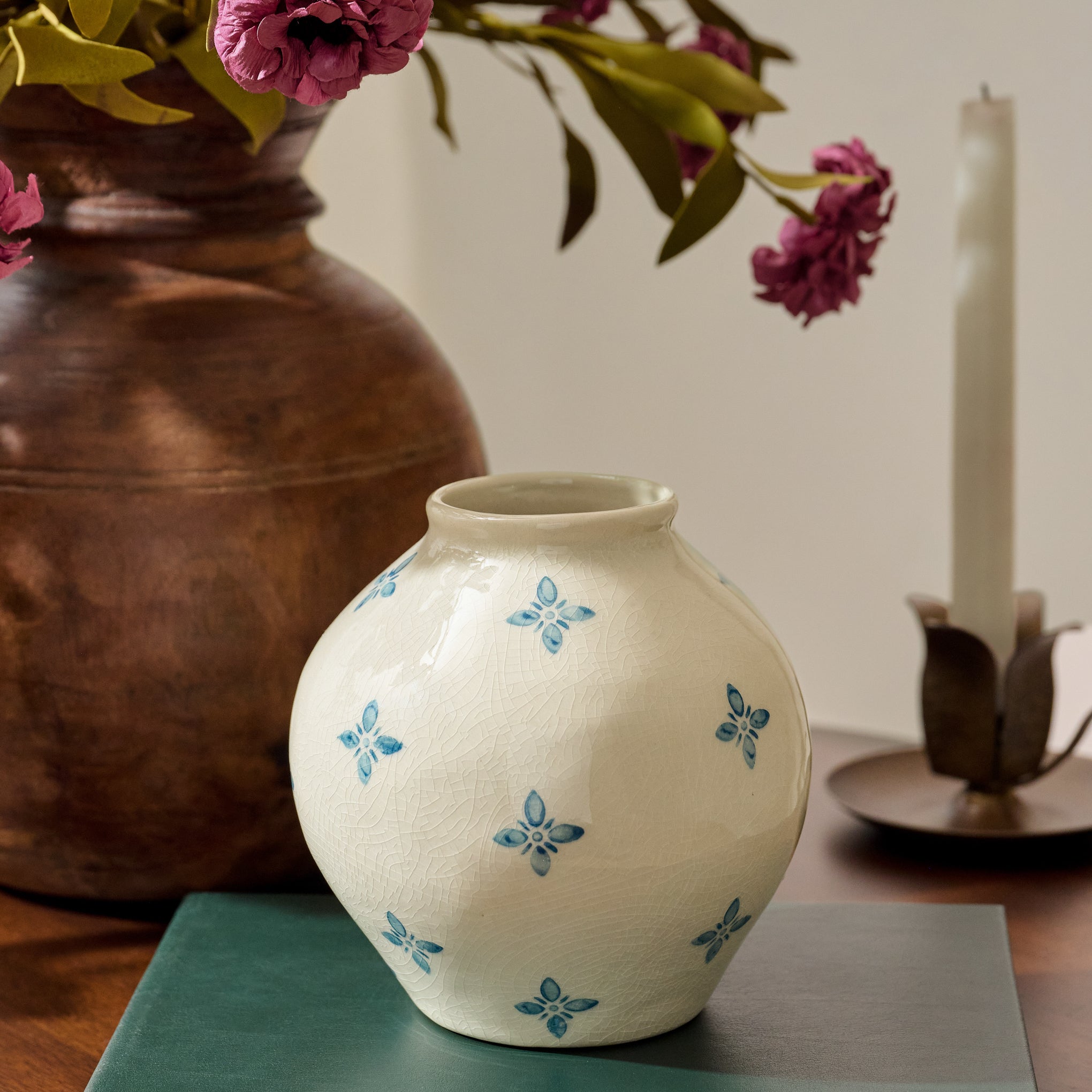 Cream and Blue Luna Bud Vase shown on nightstand