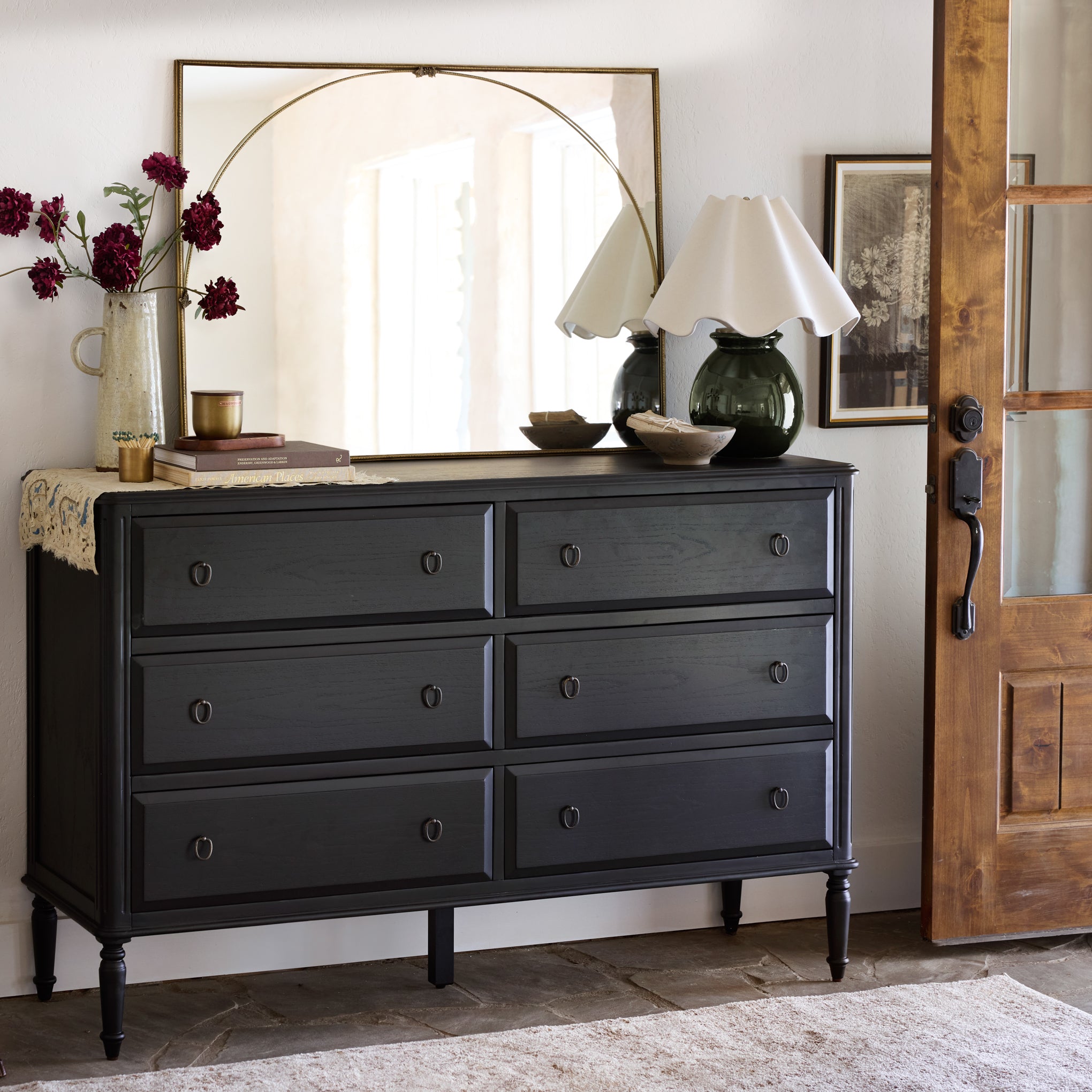 Corinne Dresser in black in a room