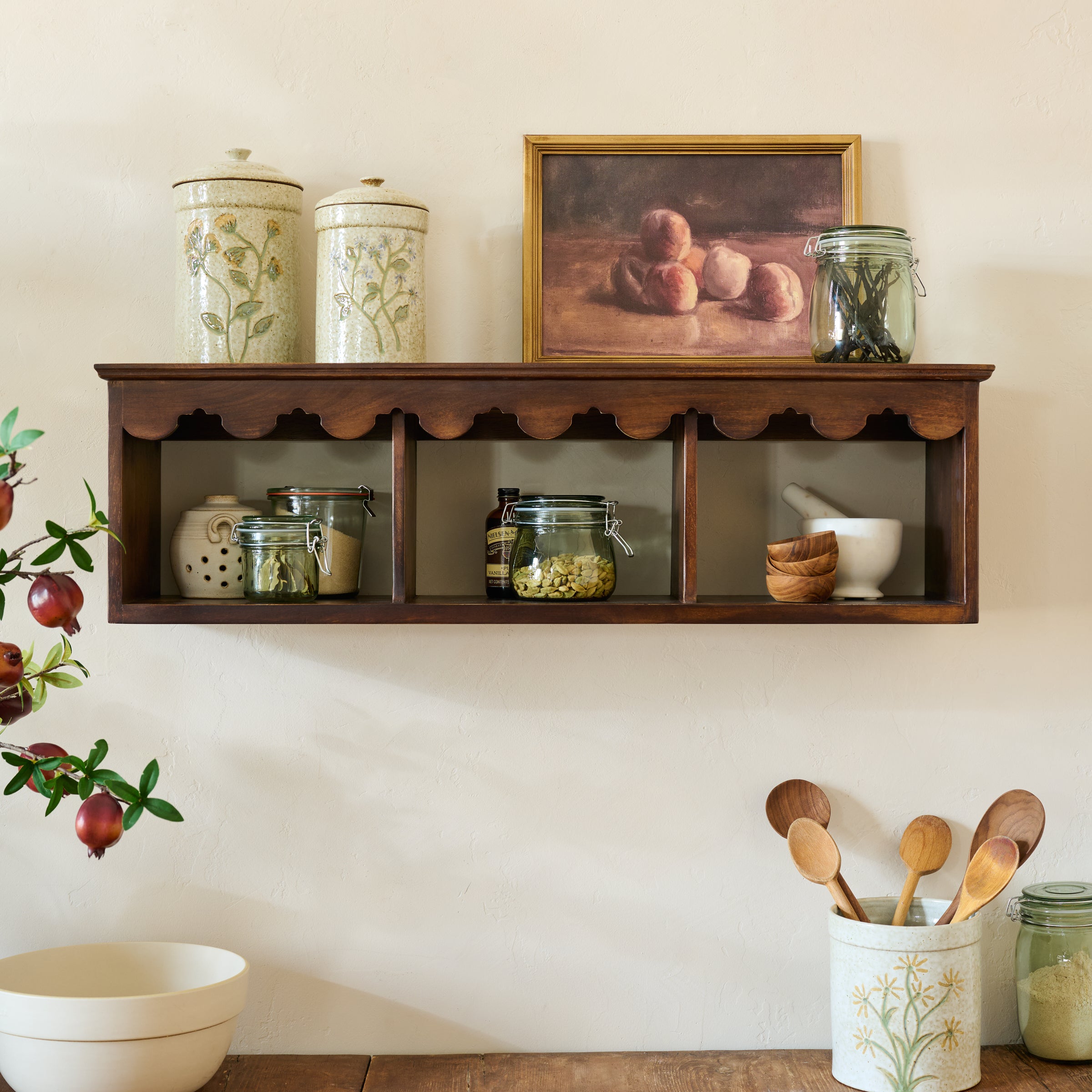 Linnea Antiqued Wood Cubby Shelf in Coffee color shown styled on wall