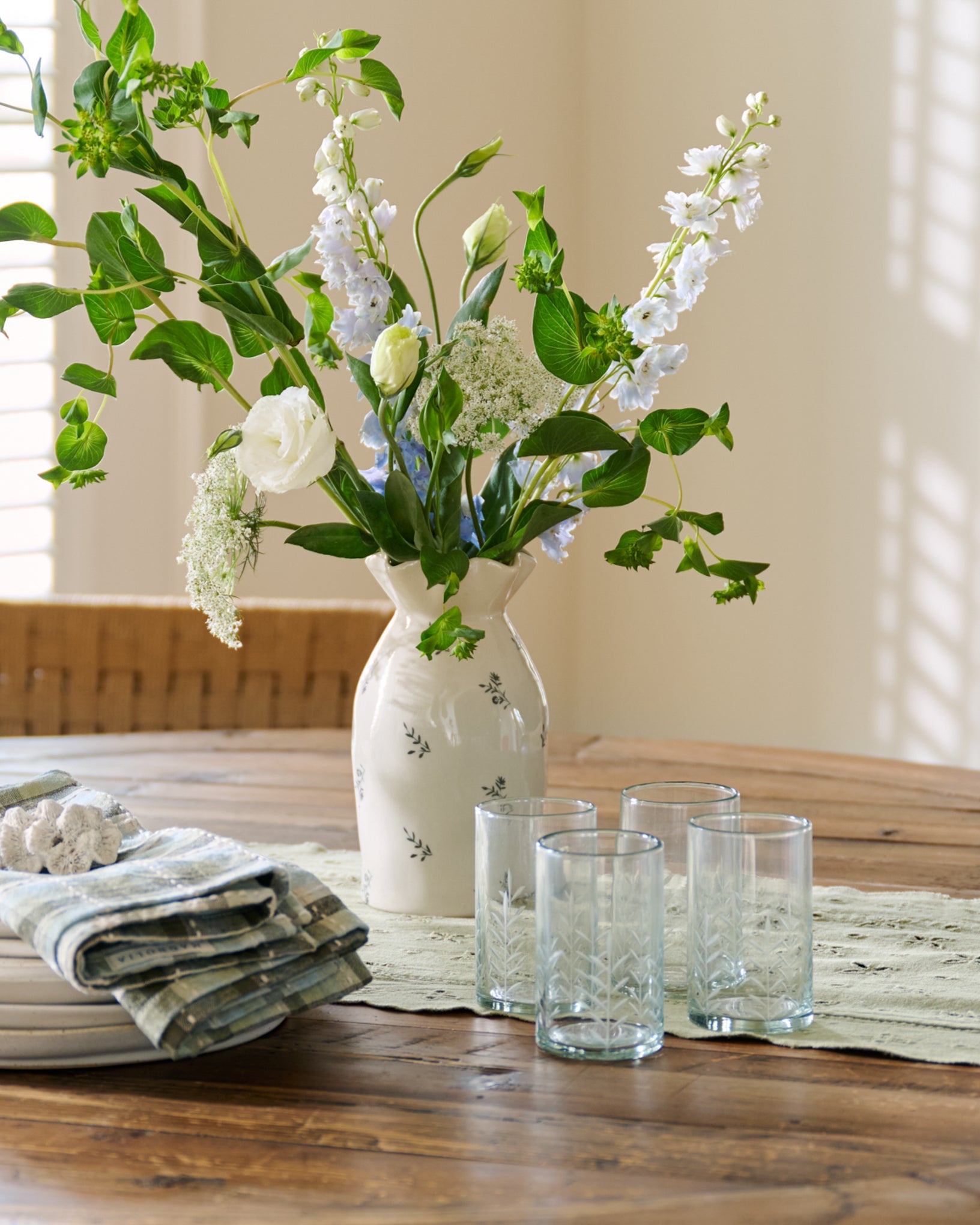Marlowe Etched Glass Tumbler on a table