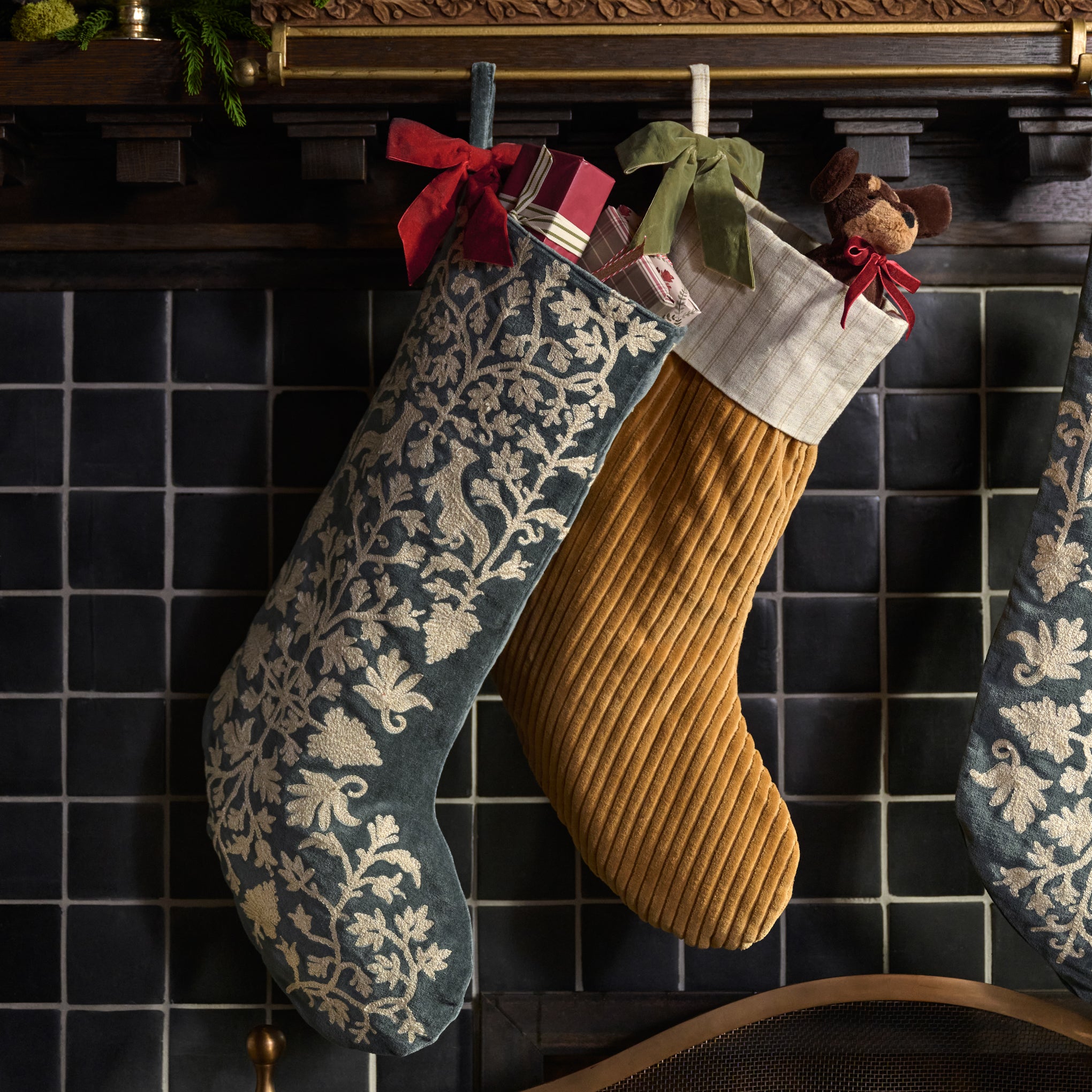 Balsam Fir Enchanted Forest Embroidered Velvet Stocking shown hung on mantel with other stocking