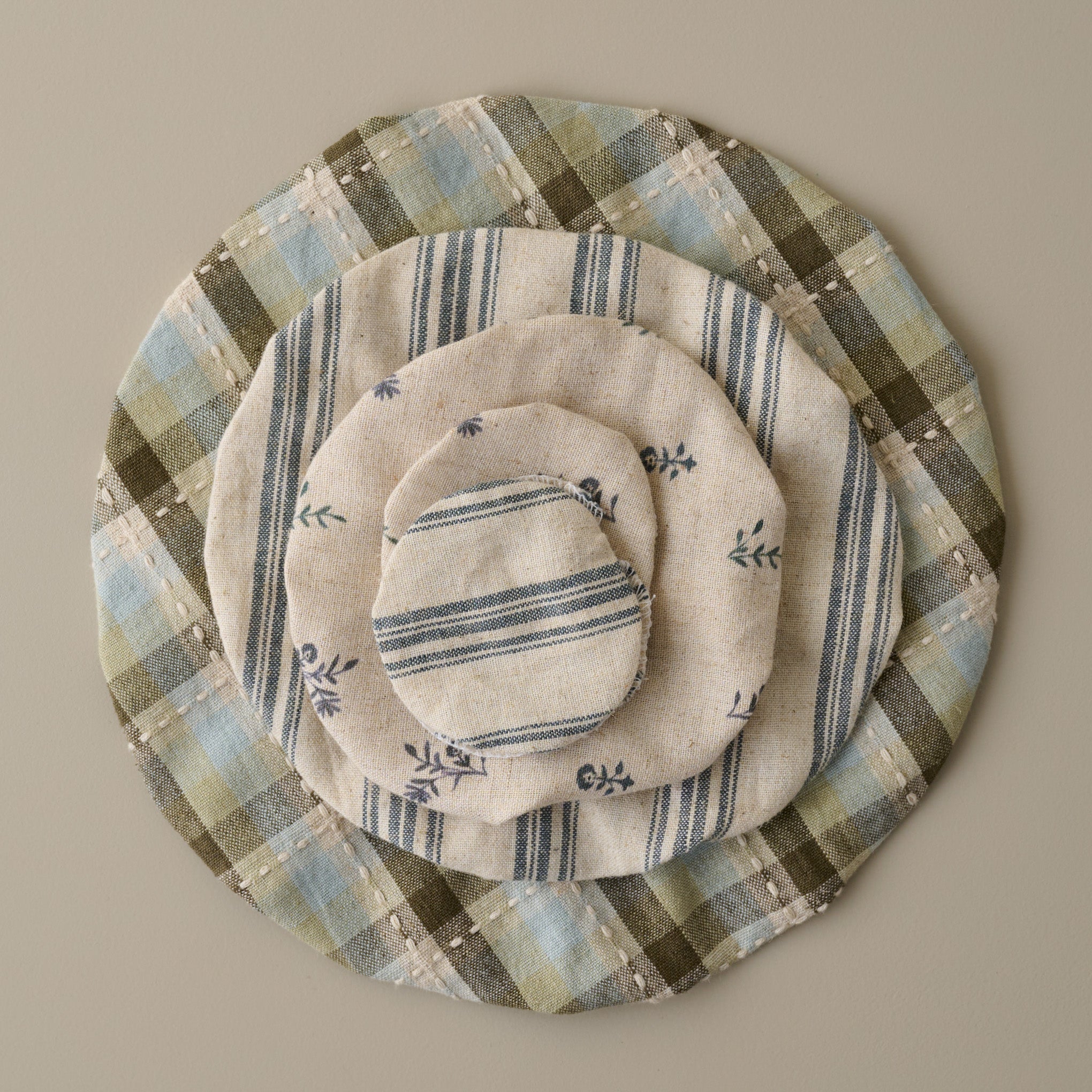 Magnoliass Bread + Jar Cover Set of Five stacked on top 