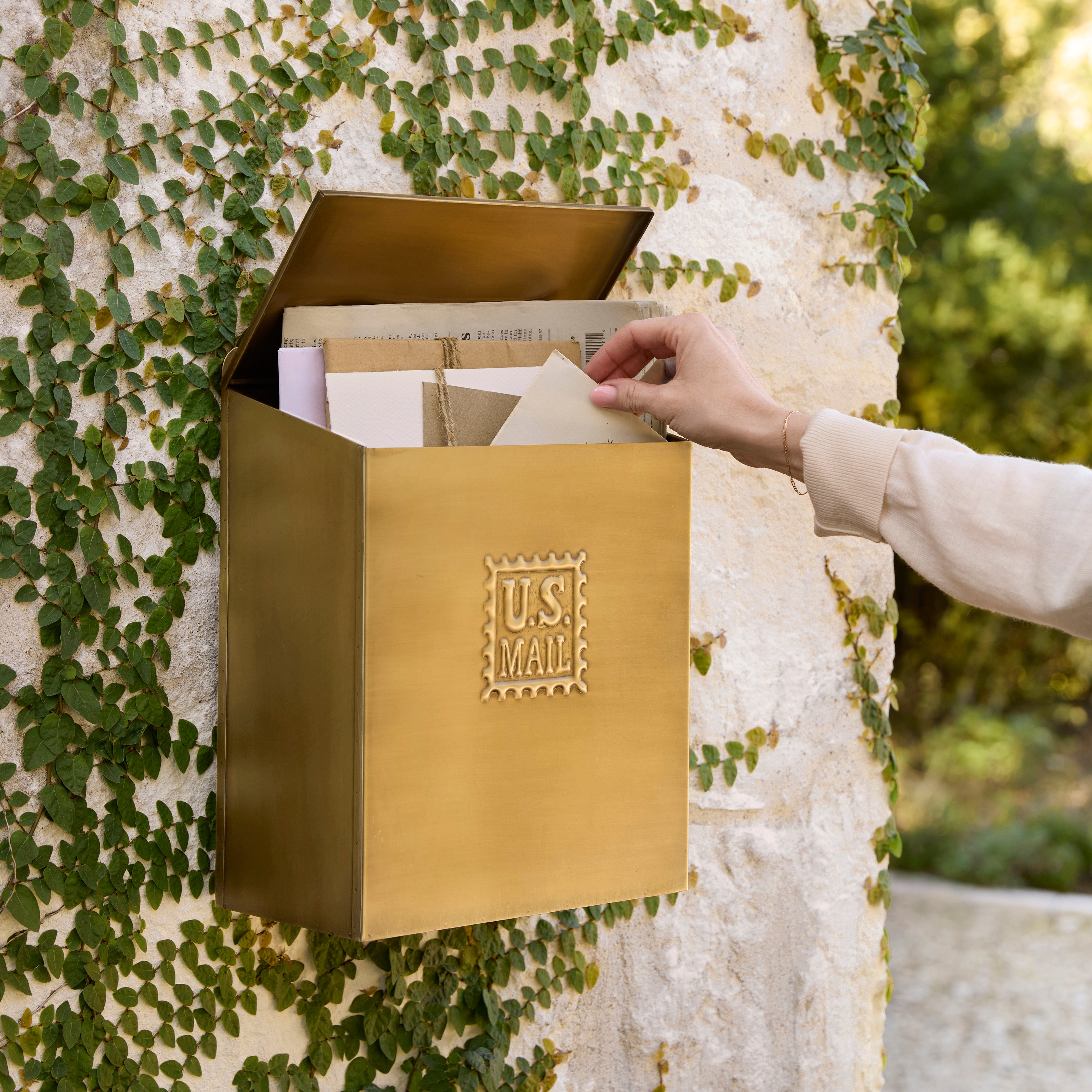 Antique Inspired Brass Mail Box outside home with mail inside 
