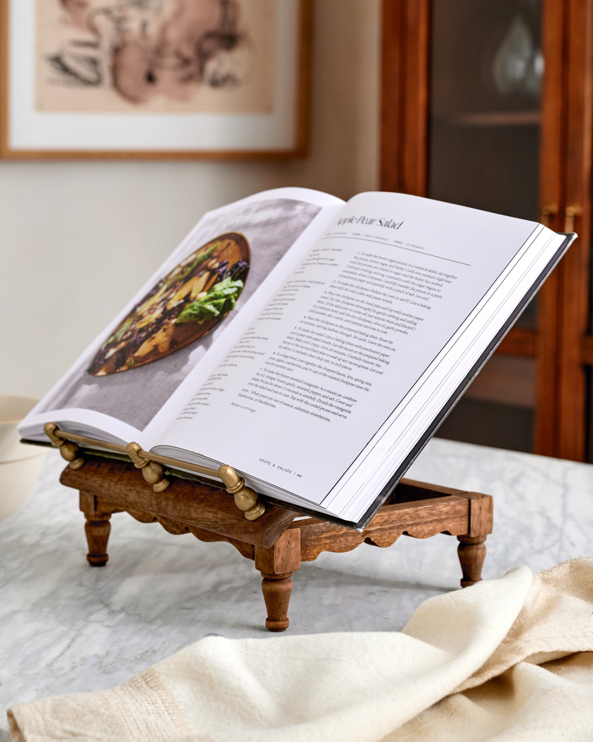 Vintage-Inspired Cookbook Holder + Riser holding an opened cookbook