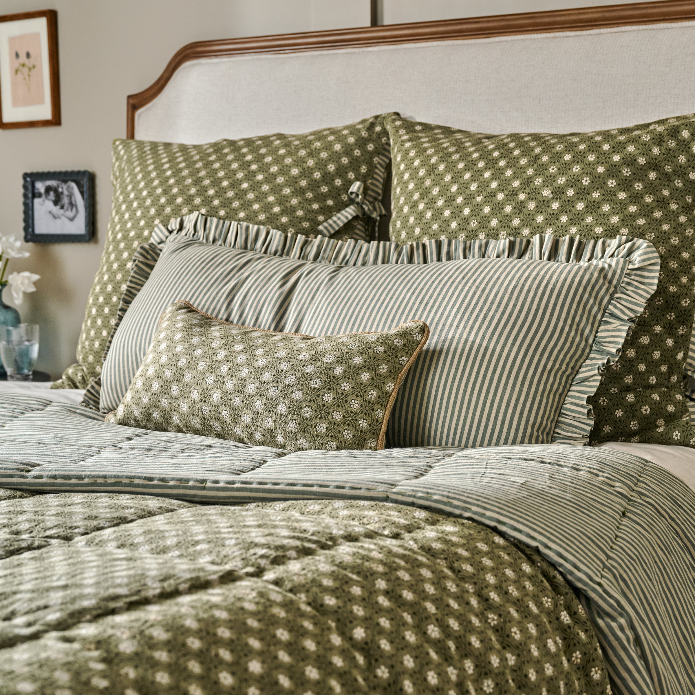 Thea Reversible Lumbar Pillow (small and large) featured on bed with Thea Reversible Quilt and sheets