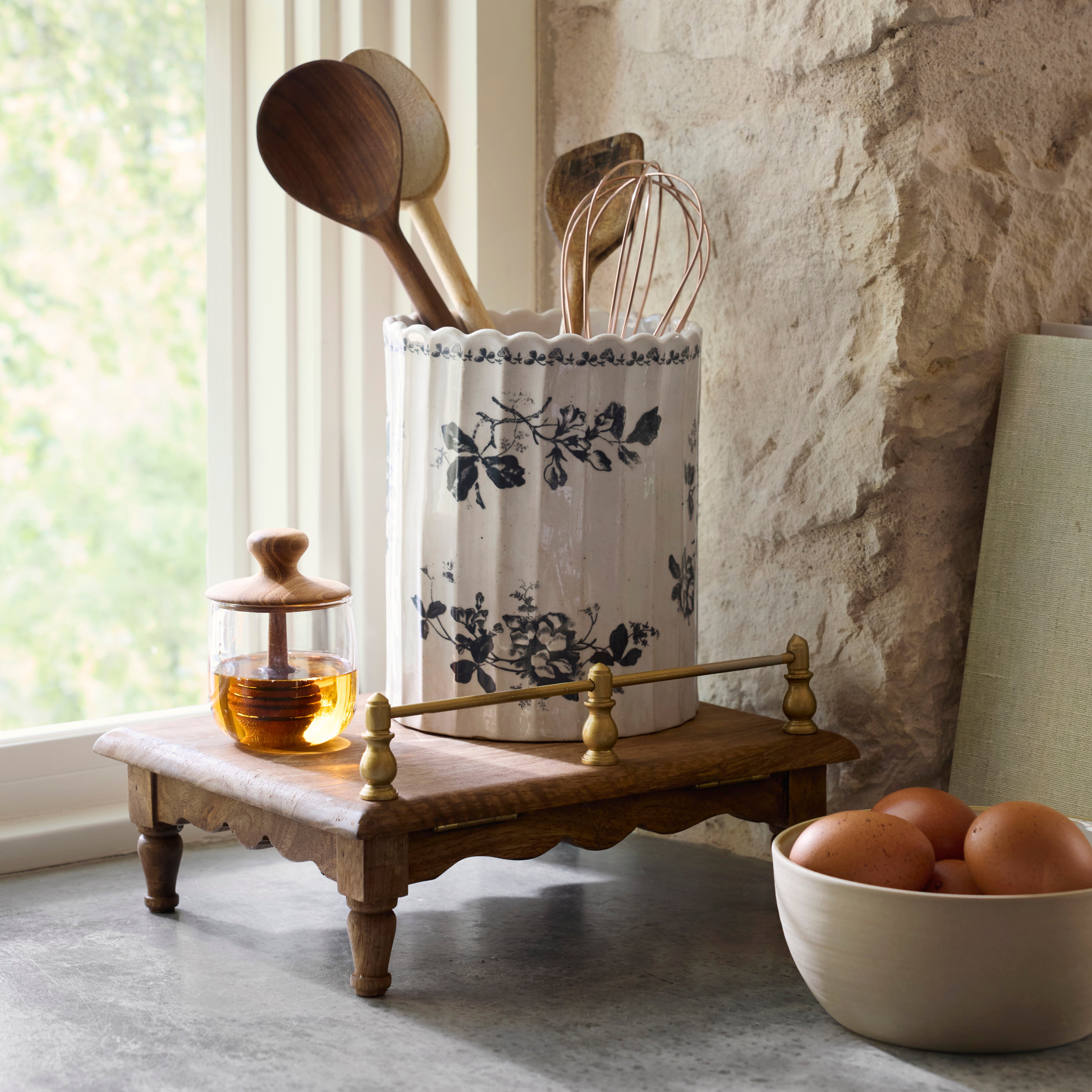 Heirloom Garden Scalloped Utensil Crock holding wood kitchen utensils sitting on top of wood riser