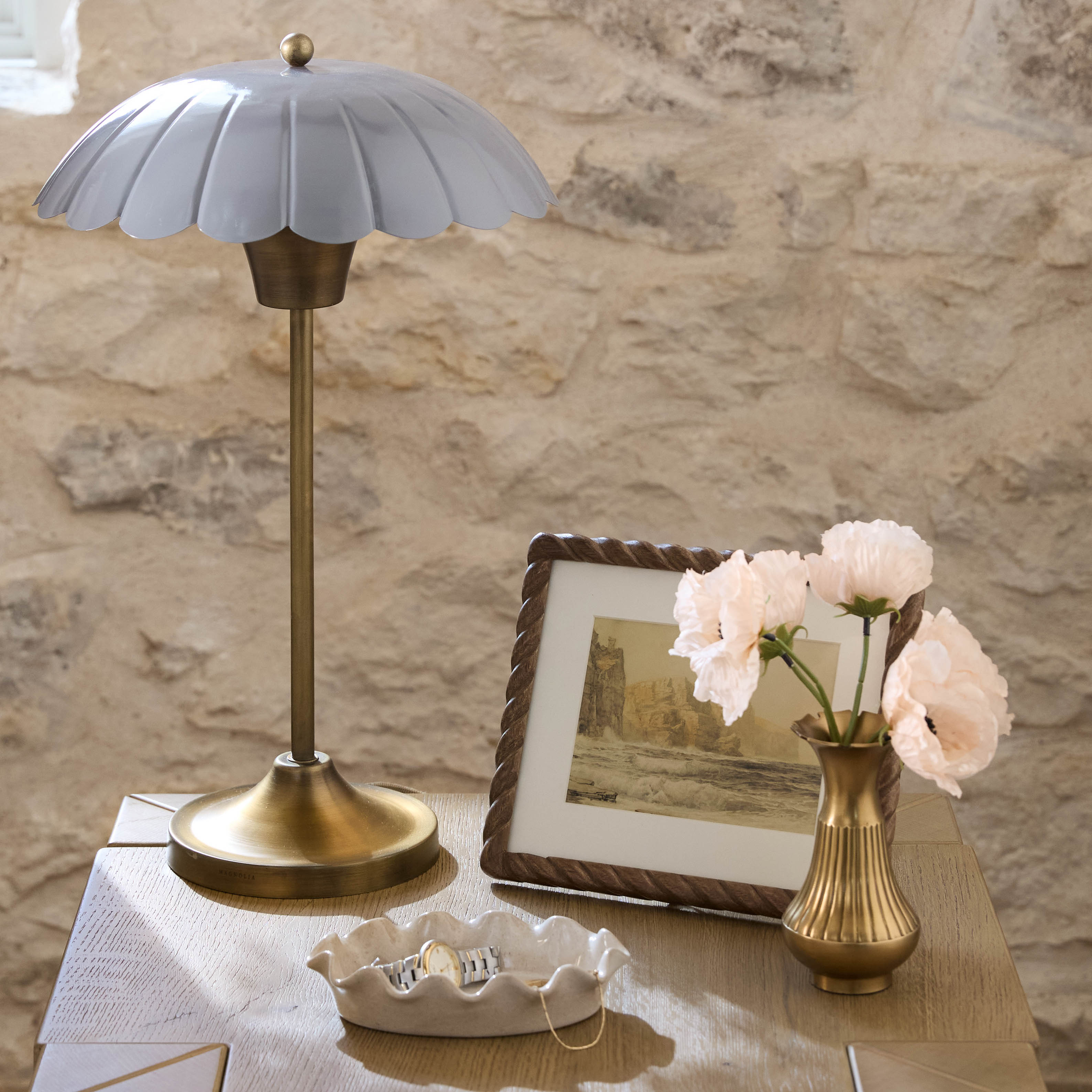 Frankie Ruffled Ceramic Tray (small) on top of nightstand with scalloped table lamp and bouquet