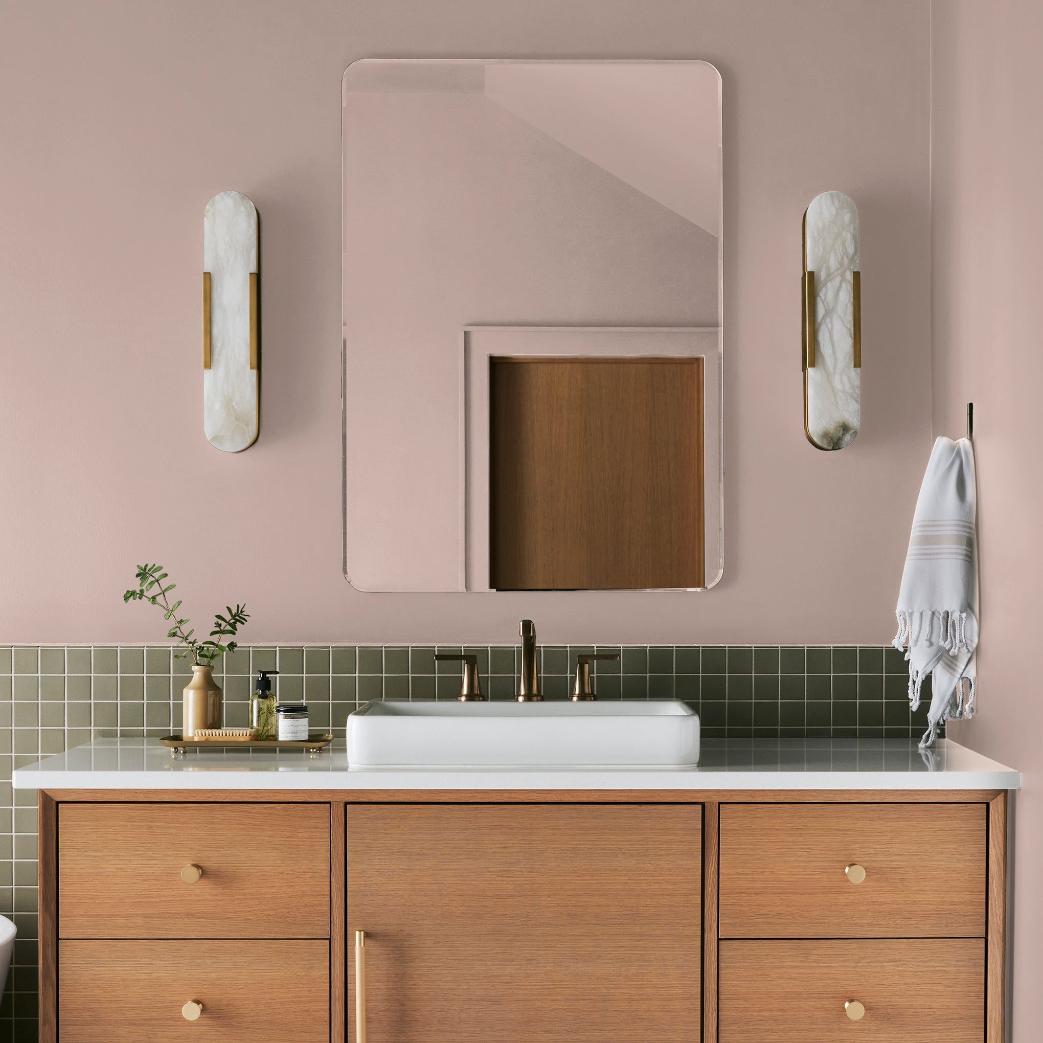 Pale neutral pink with accents of peach paint named ella rose shown painted on bathroom wall