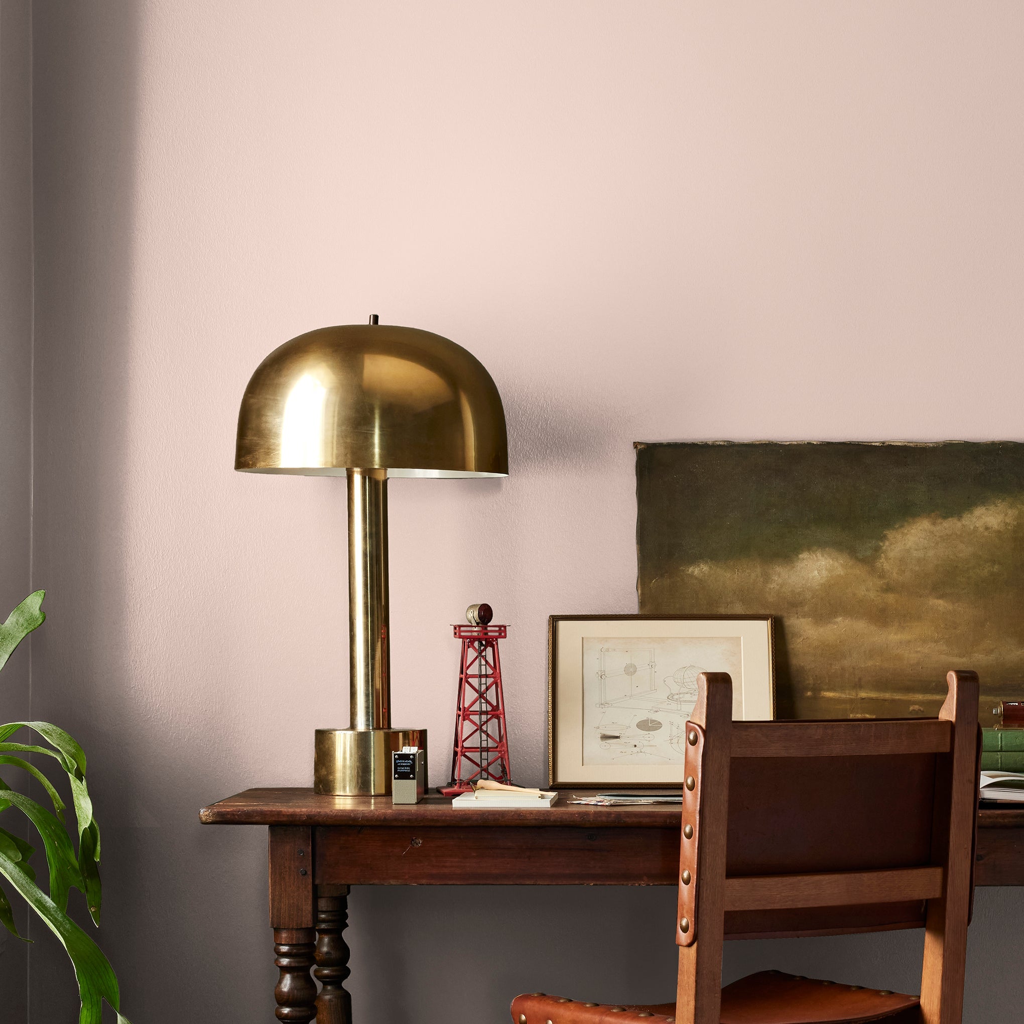 Pale neutral pink with accents of peach paint named ella rose shown painted on bedroom wall