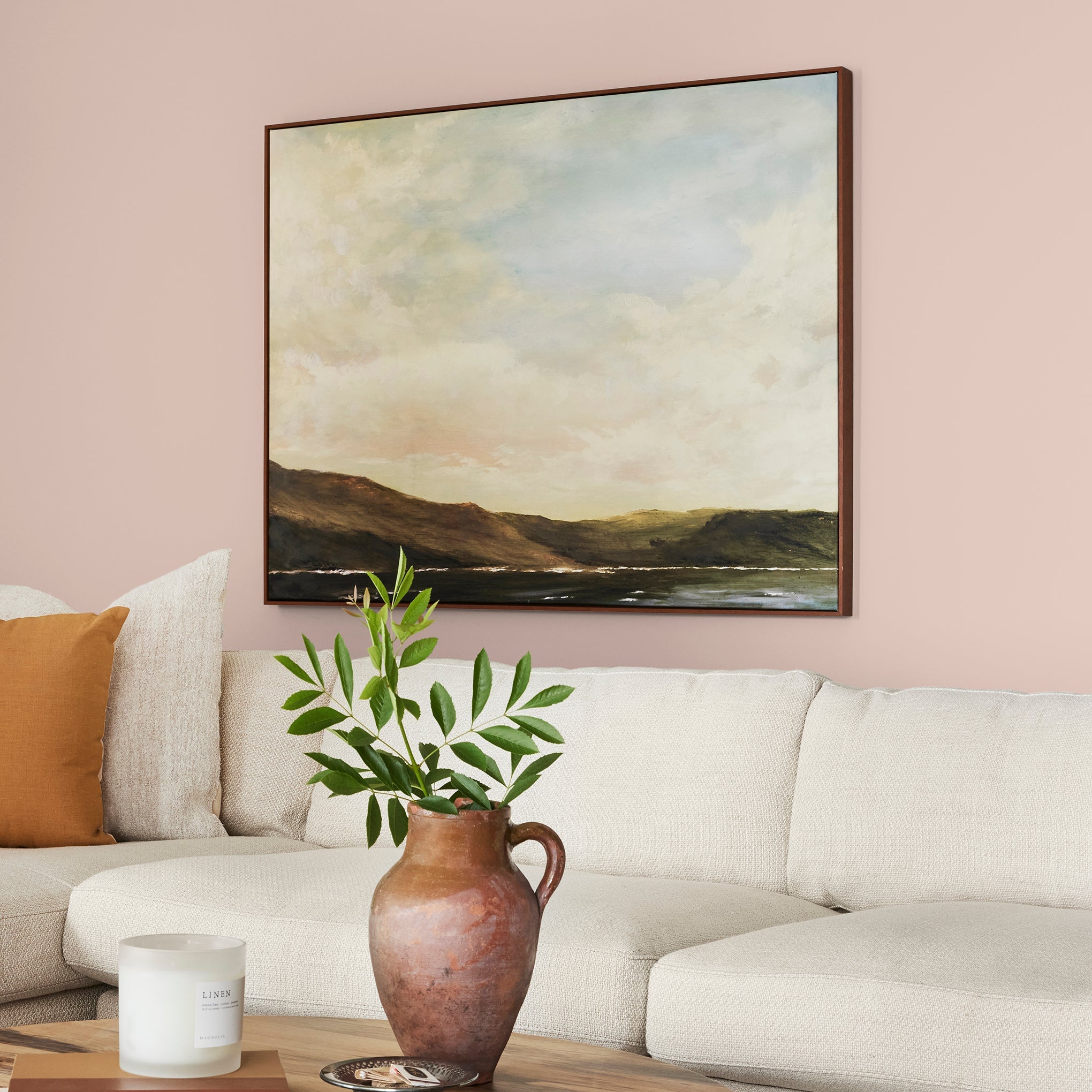 Pale neutral pink with accents of peach paint named ella rose shown painted on living room wall