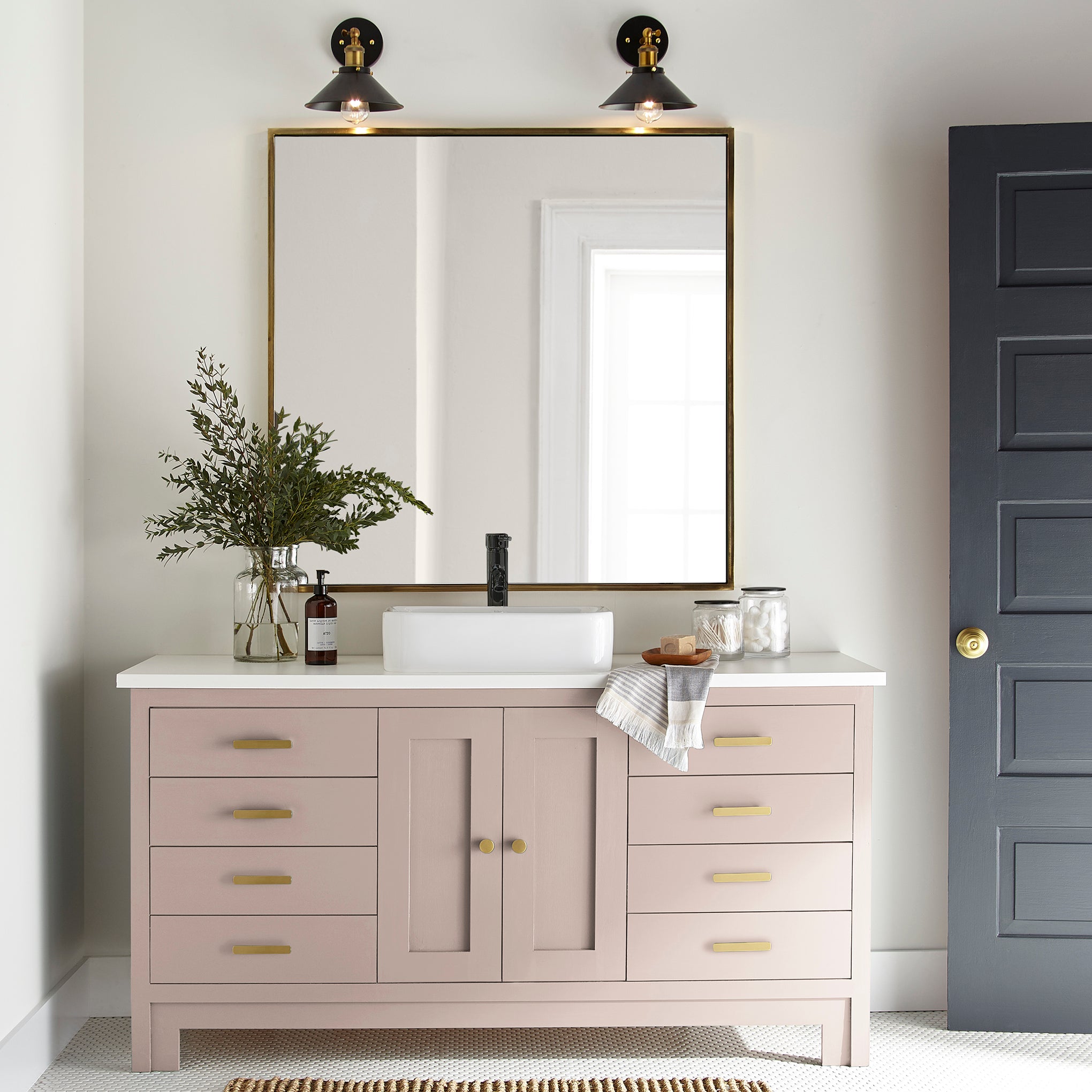Pale neutral pink with peach door and cabinet paint named ella rose shown painted on bathroom cabinet