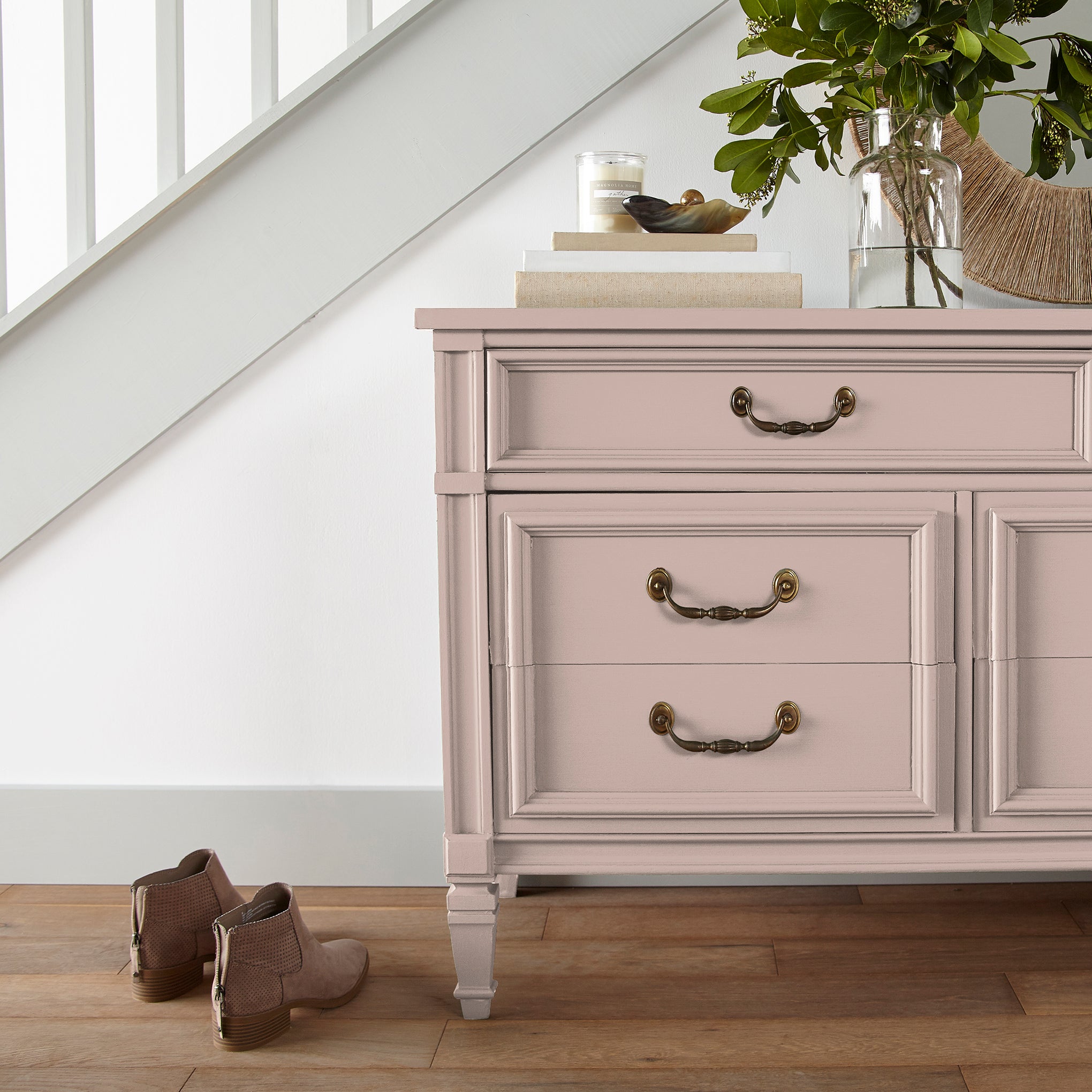 Pale neutral pink with peach door and cabinet paint named ella rose shown painted on entryway cabinet
