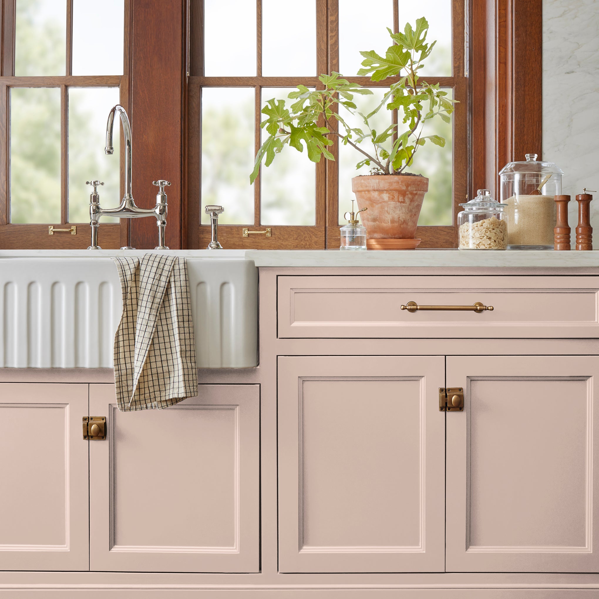 Pale neutral pink with peach door and cabinet paint named ella rose shown painted on kitchen cabinet