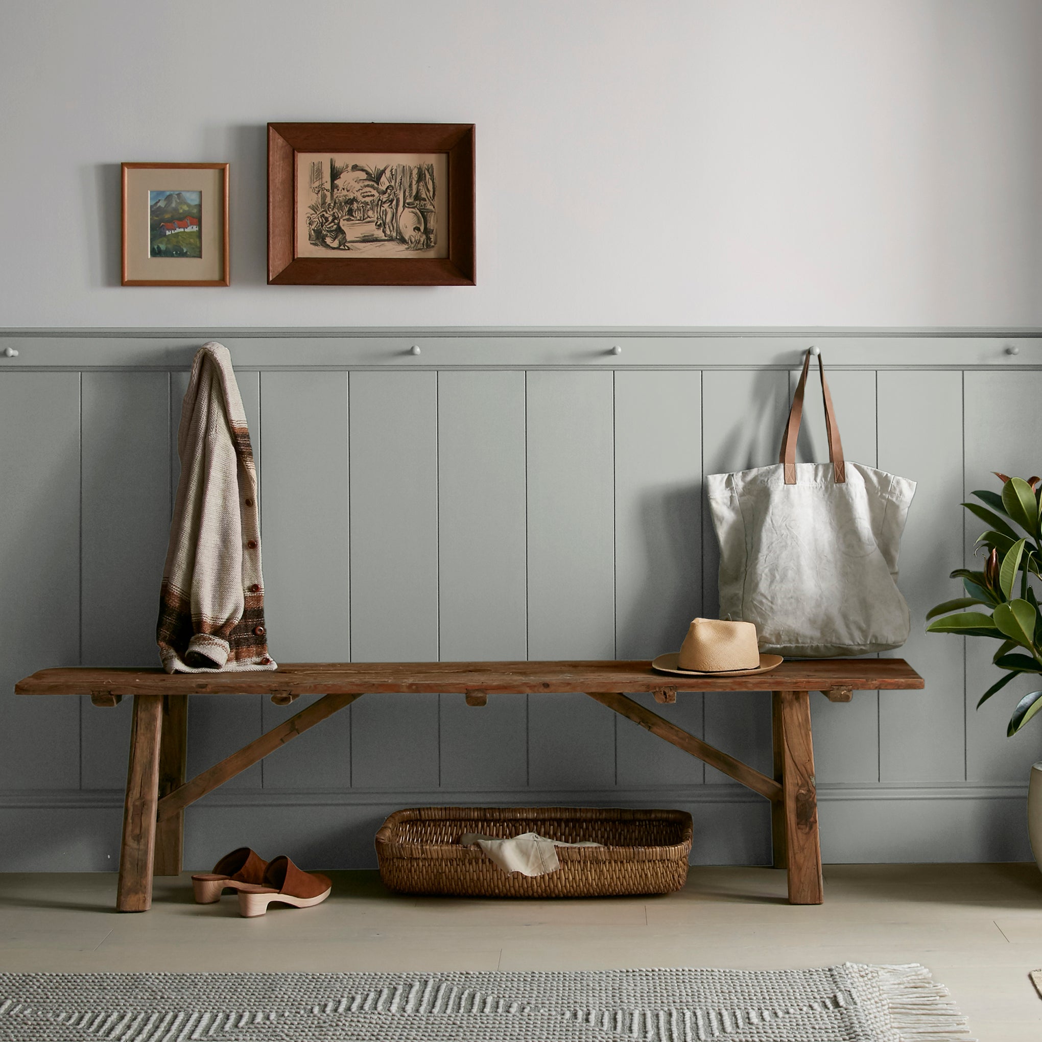 An overcast gray with hints of pale blue and green interior paint named weathered windmill shown on entryway wall