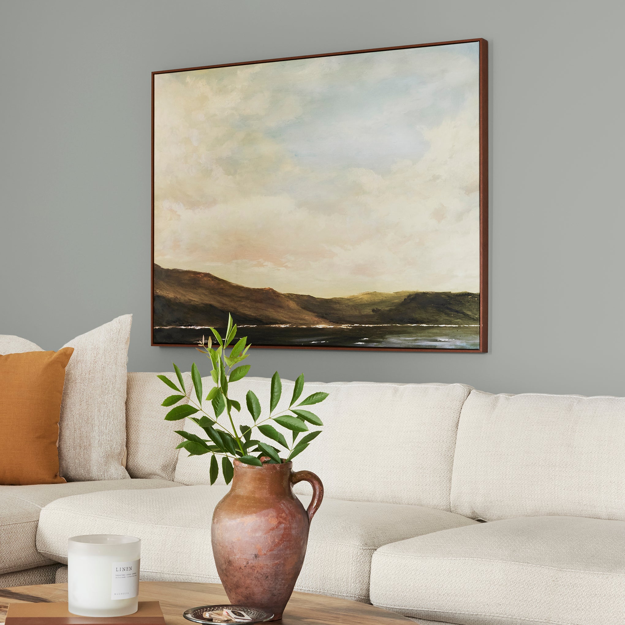 An overcast gray with hints of pale blue and green interior paint named weathered windmill shown on living room wall