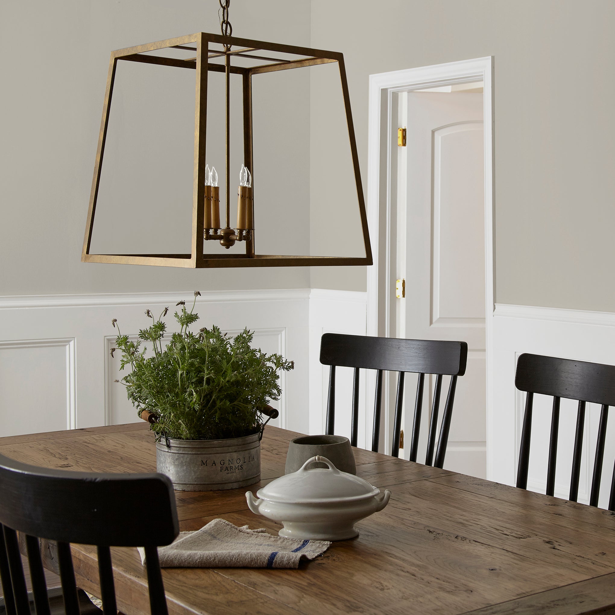 medium warm grey paint named sunday stroll shown painted on dining room wall