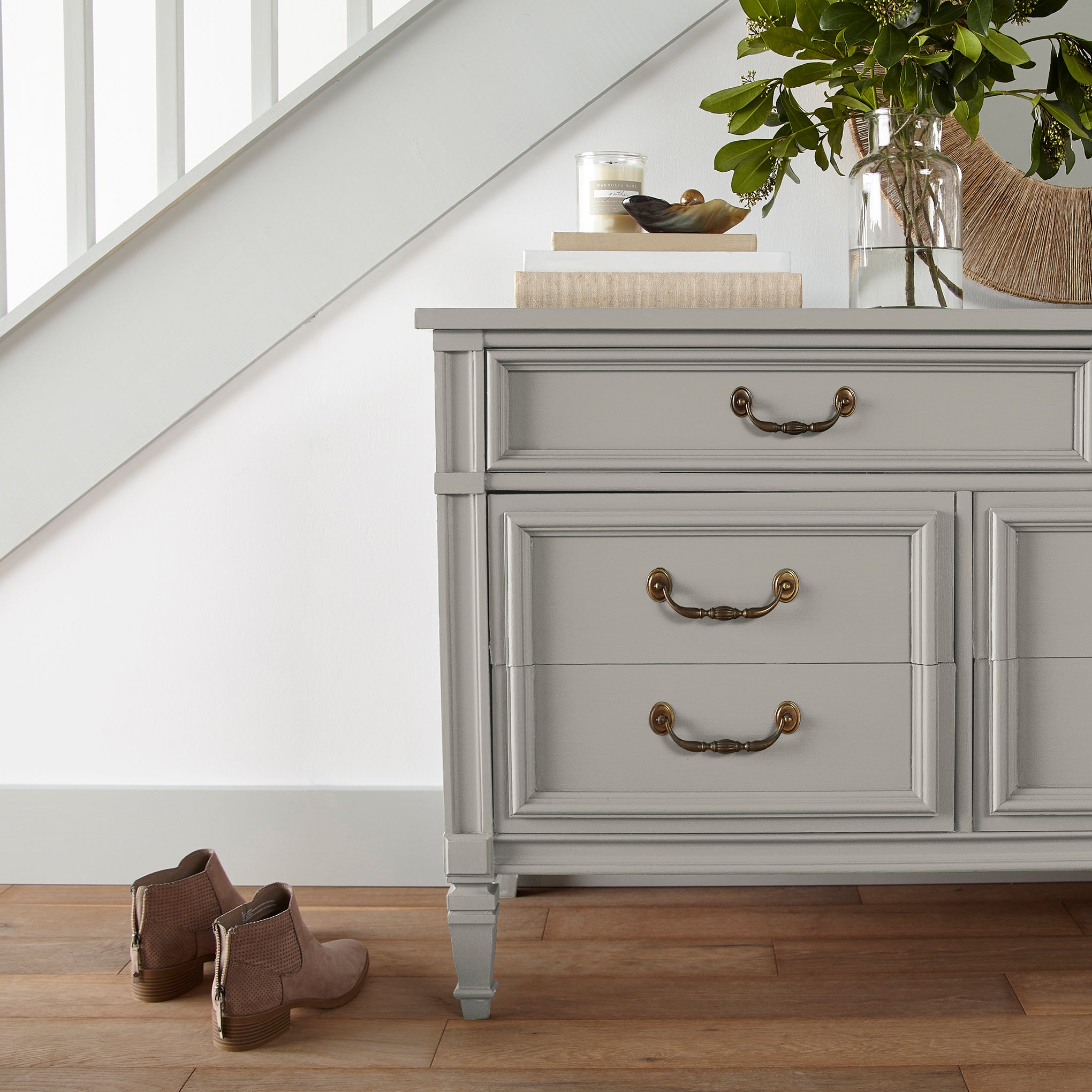 medium warm grey paint named sunday stroll shown painted on entryway cabinet