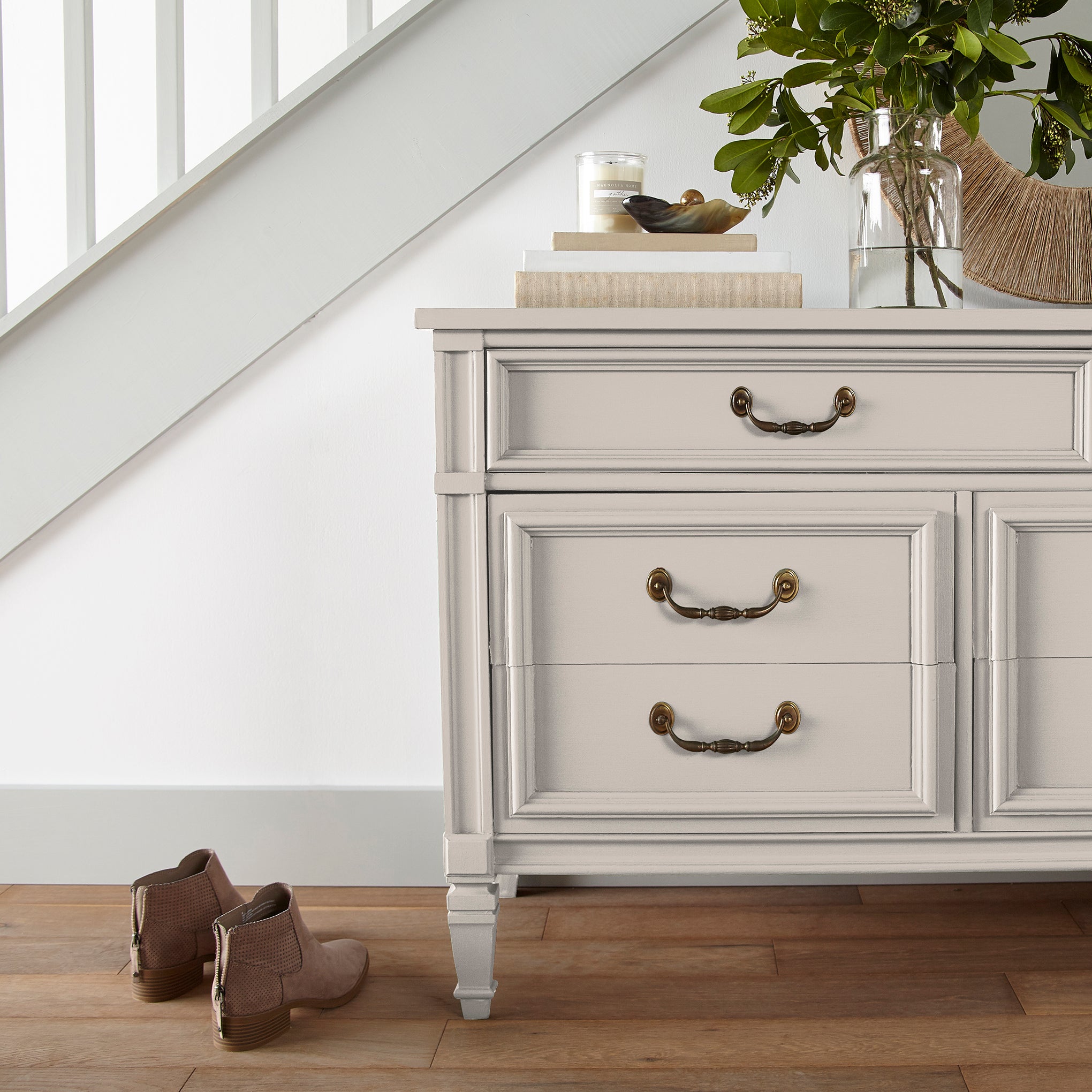 ivory with pink undertones paint named antique rose shown painted on entryway cabinet