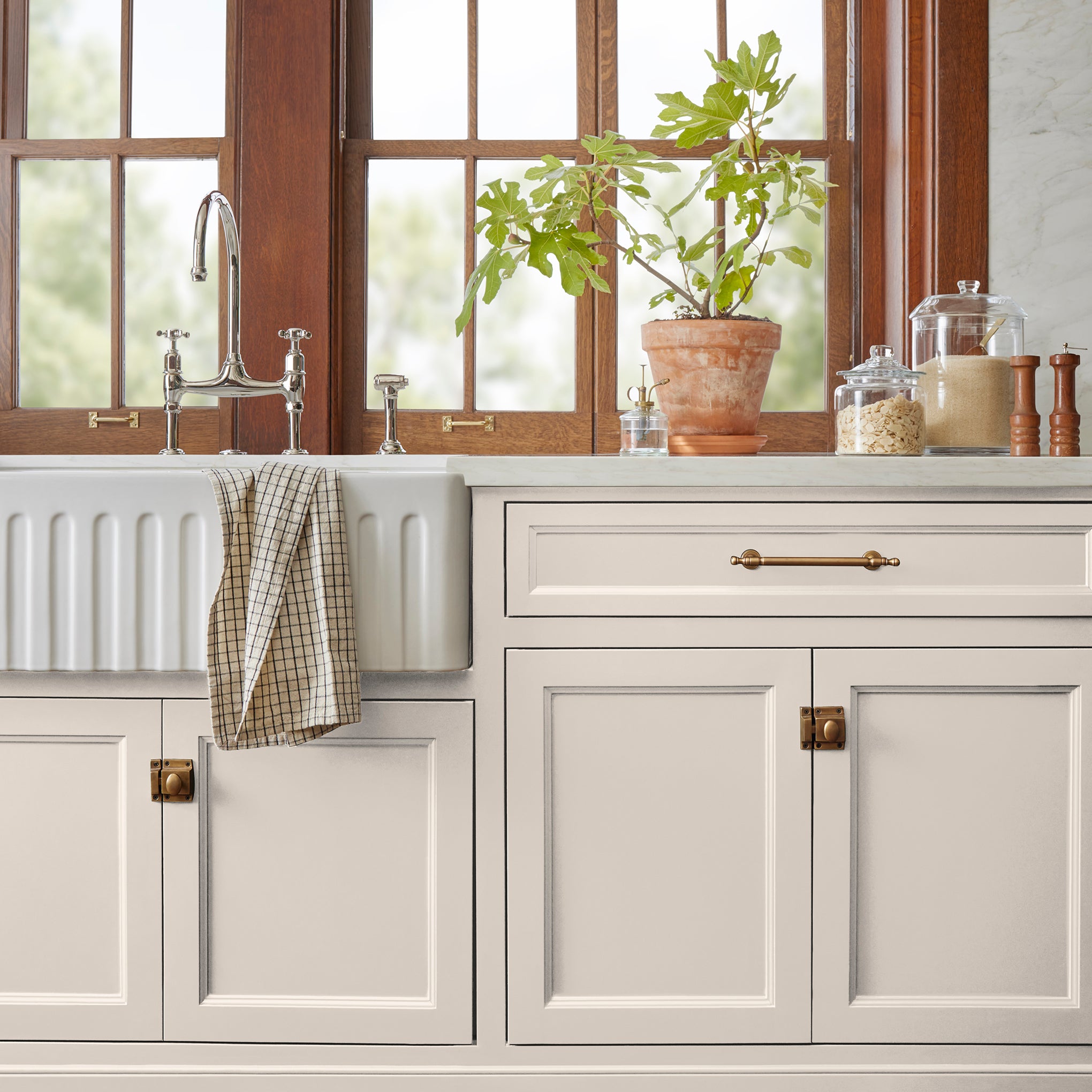 ivory with pink undertones paint named antique rose shown painted on kitchen cabinet
