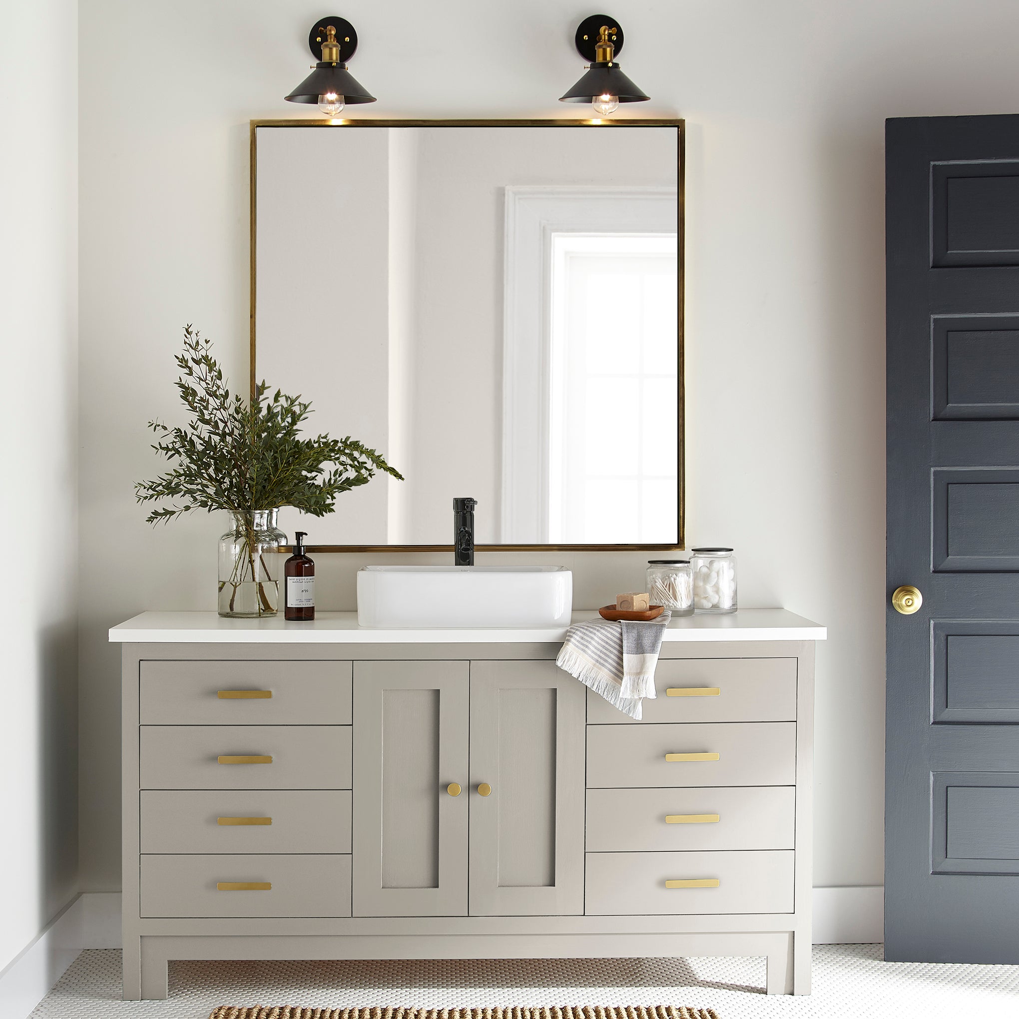medium grey with tan undertones paint named gatherings shown painted on bathroom cabinet