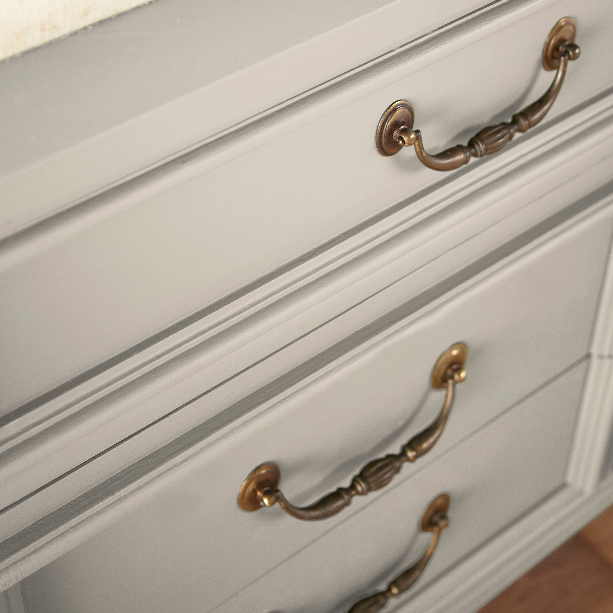 medium grey with tan undertones paint named gatherings shown painted on cabinet