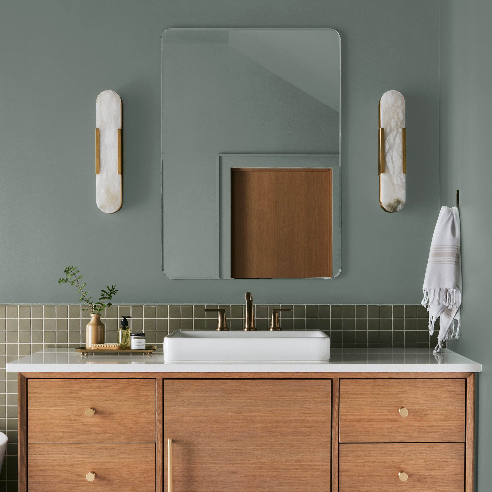 Deep gray with hues of rich blue and sage green interior paint named silverado sage shown painted on bathroom wall
