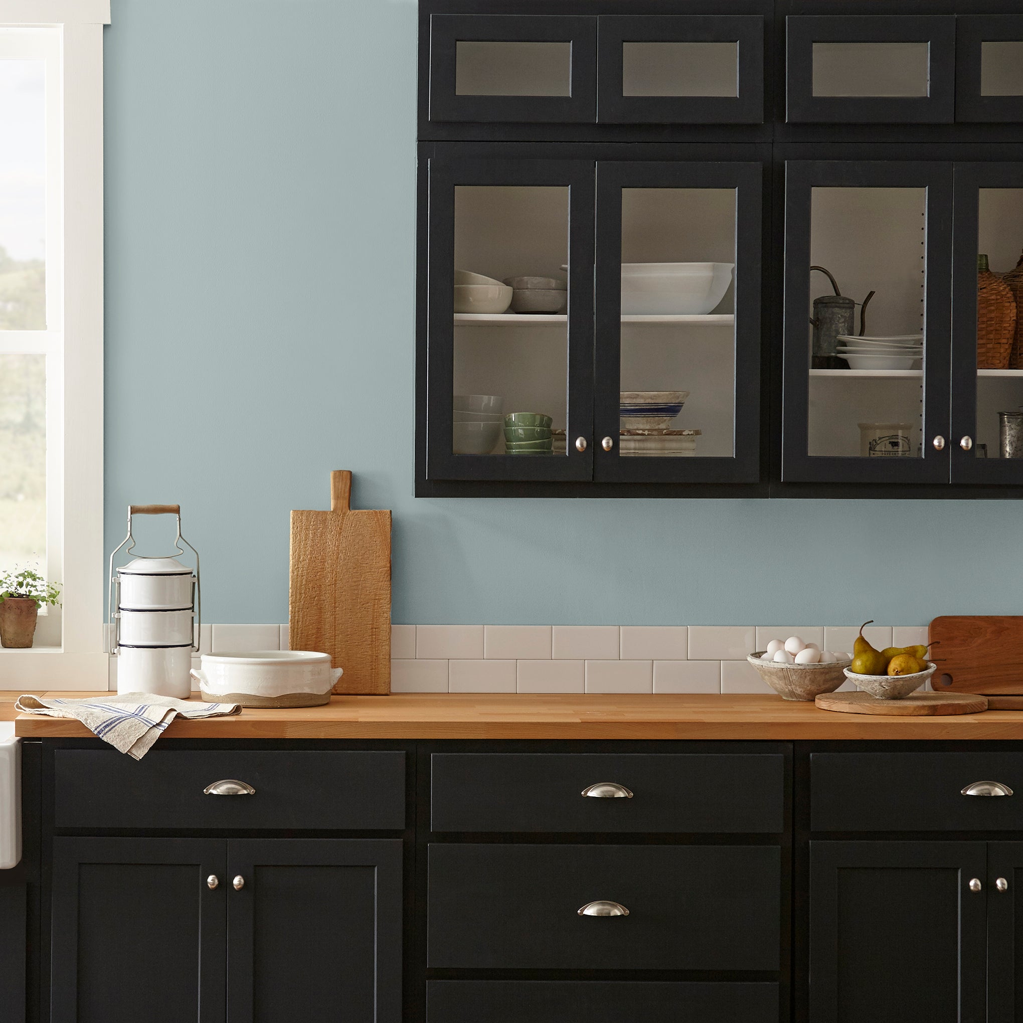 muted grey blue interior paint named rainy days shown painted on kitchen wall