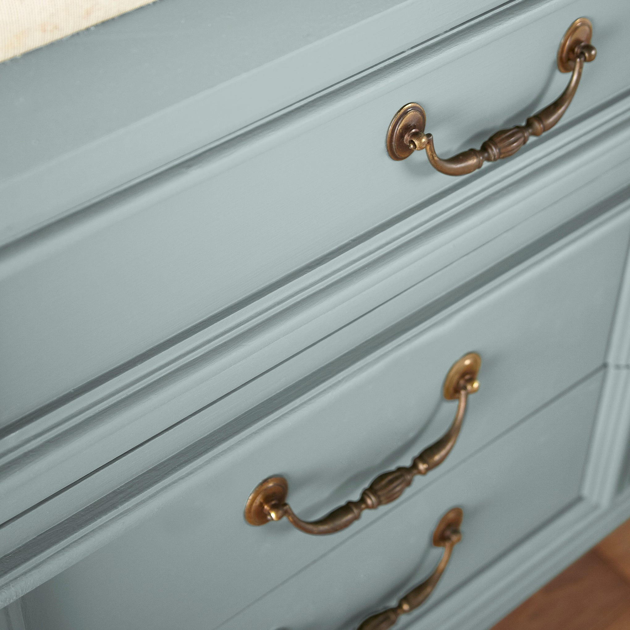 muted grey-blue paint named rainy days shown painted on cabinet