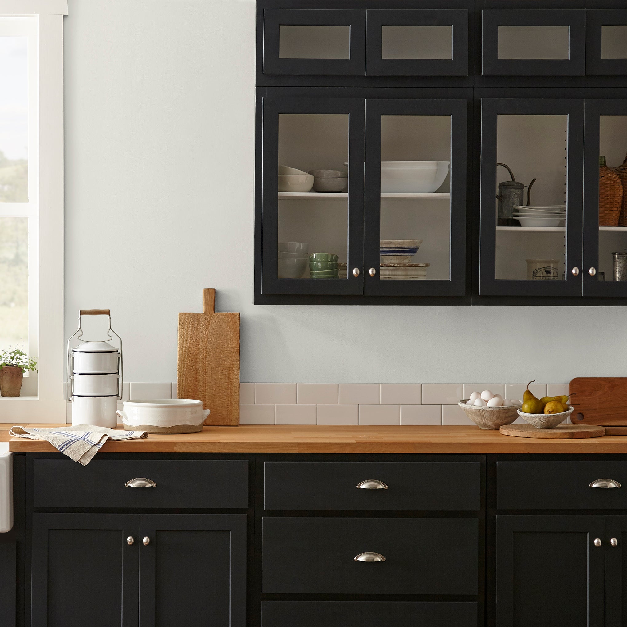 creamy weathered white interior paint named shiplap shown painted on kitchen wall