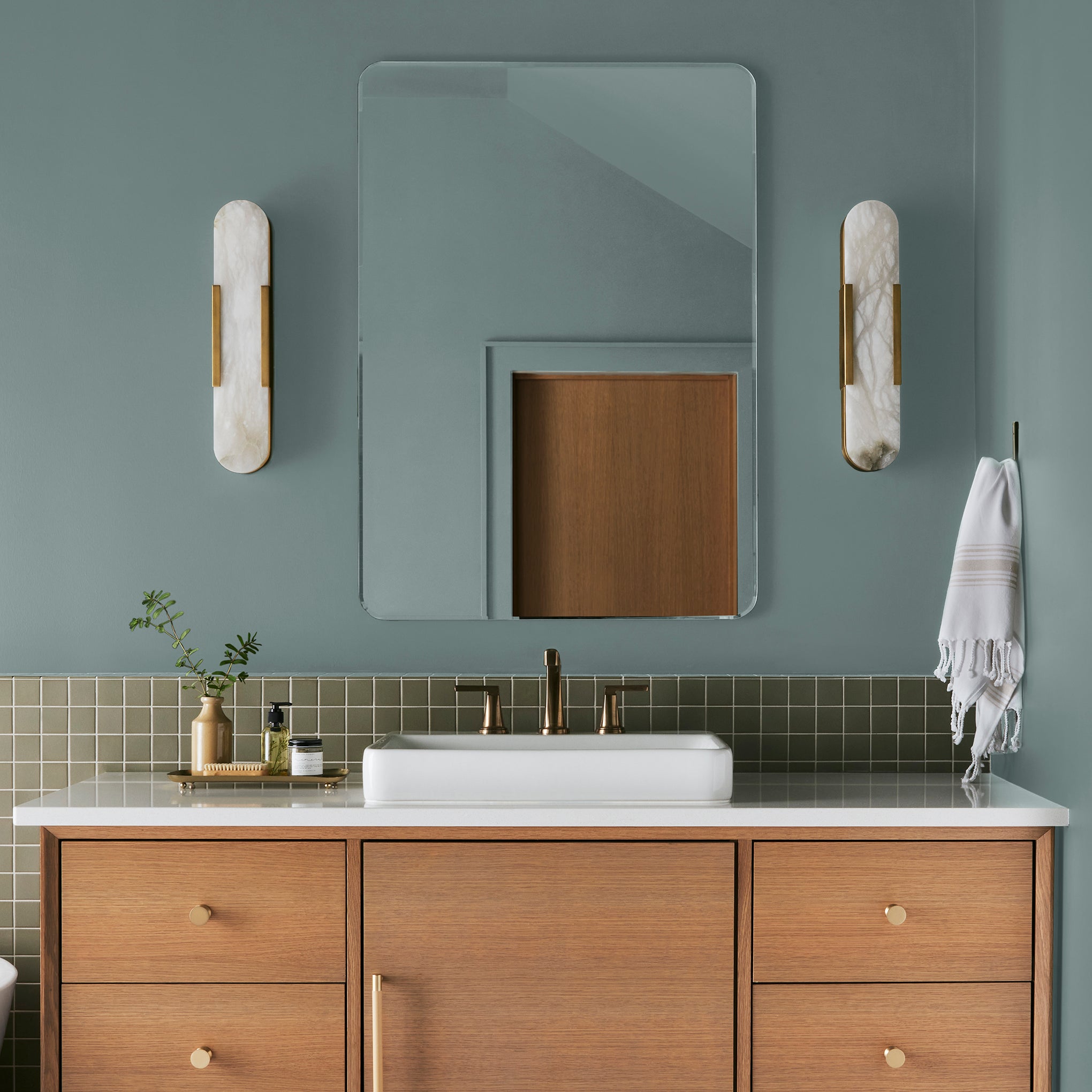 medium grey-aqua blue interior paint named sir drake shown painted on bathroom wall