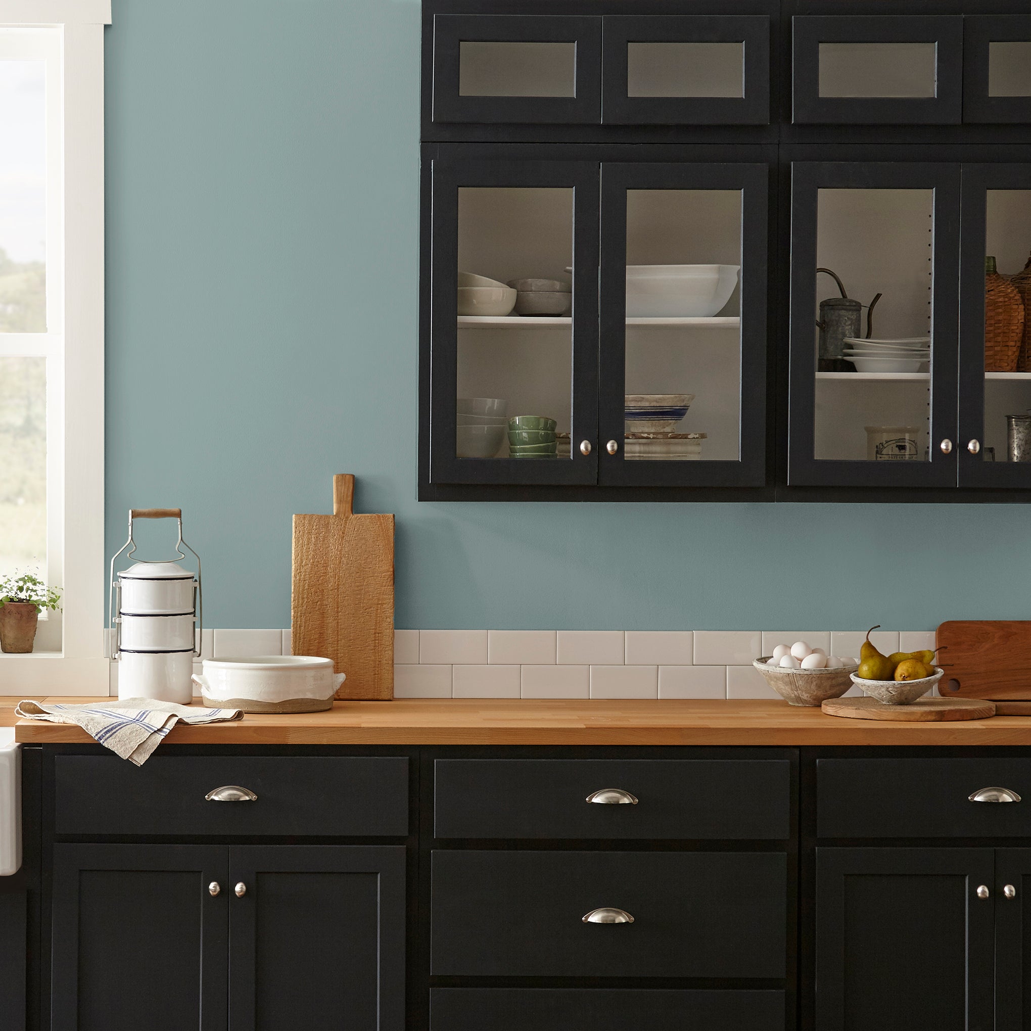 medium grey-aqua blue interior paint named sir drake shown painted on kitchen wall