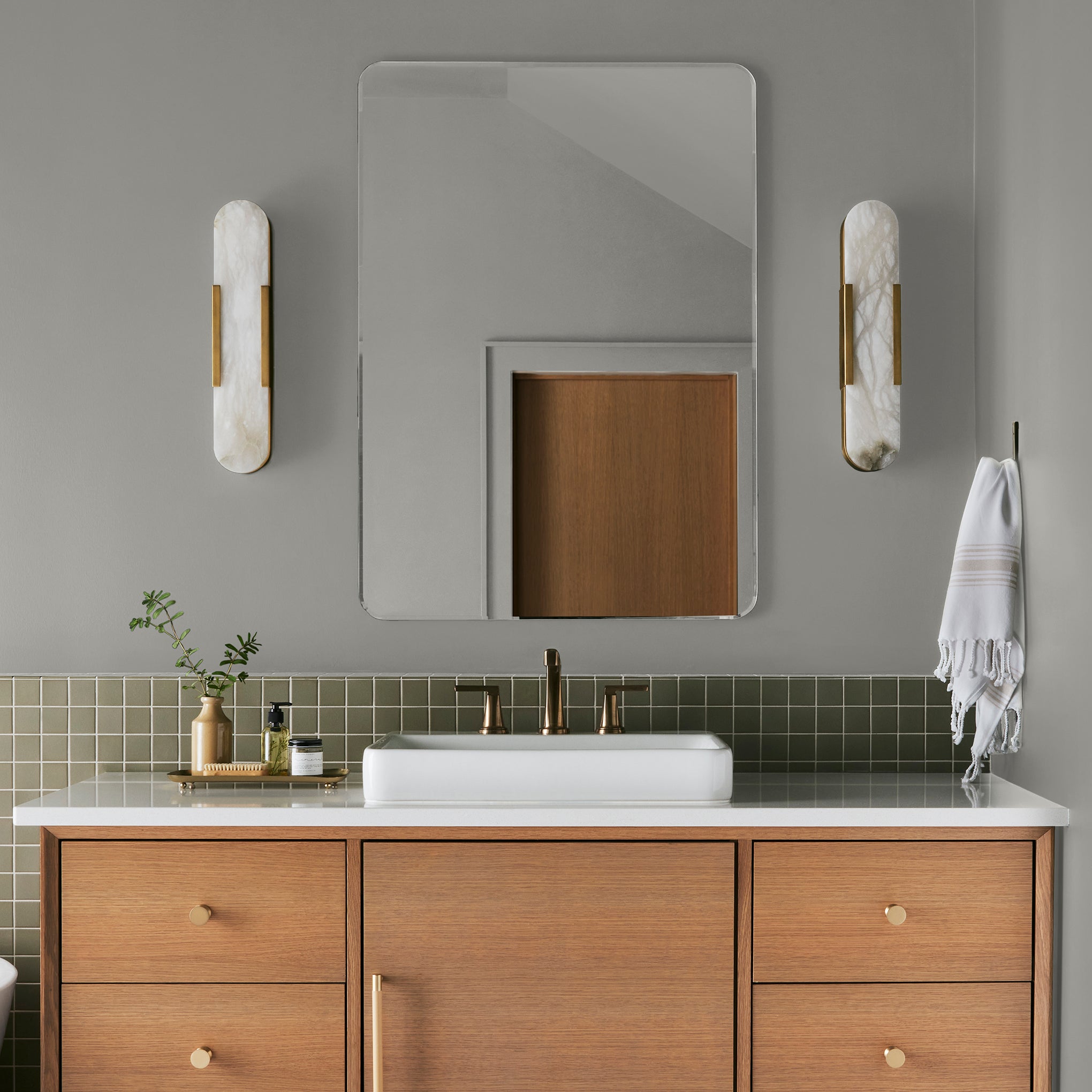 pure grey with a tan undertone interior paint named cupola shown painted on bathroom wall