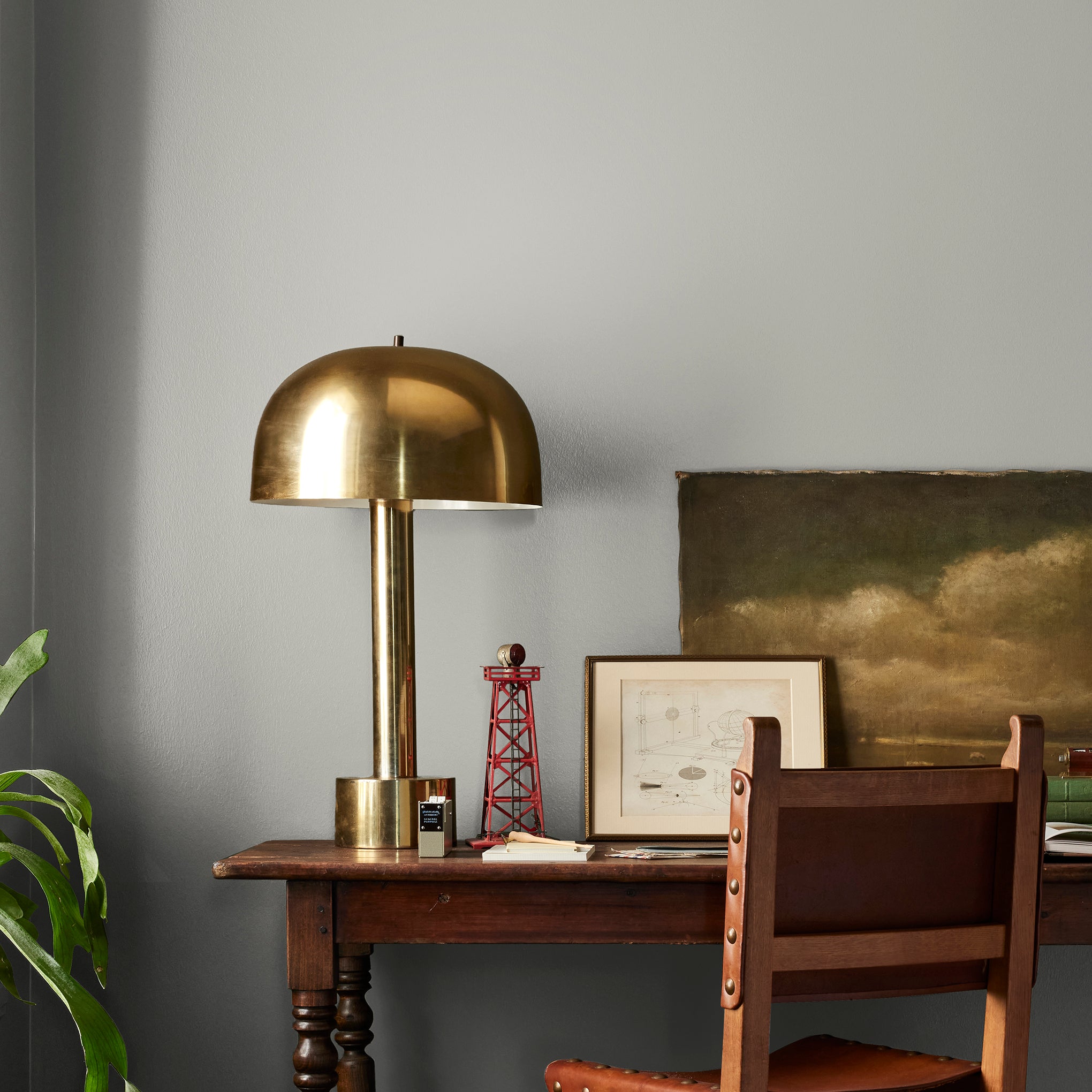 pure grey with a tan undertone interior paint named cupola shown painted on bedroom wall