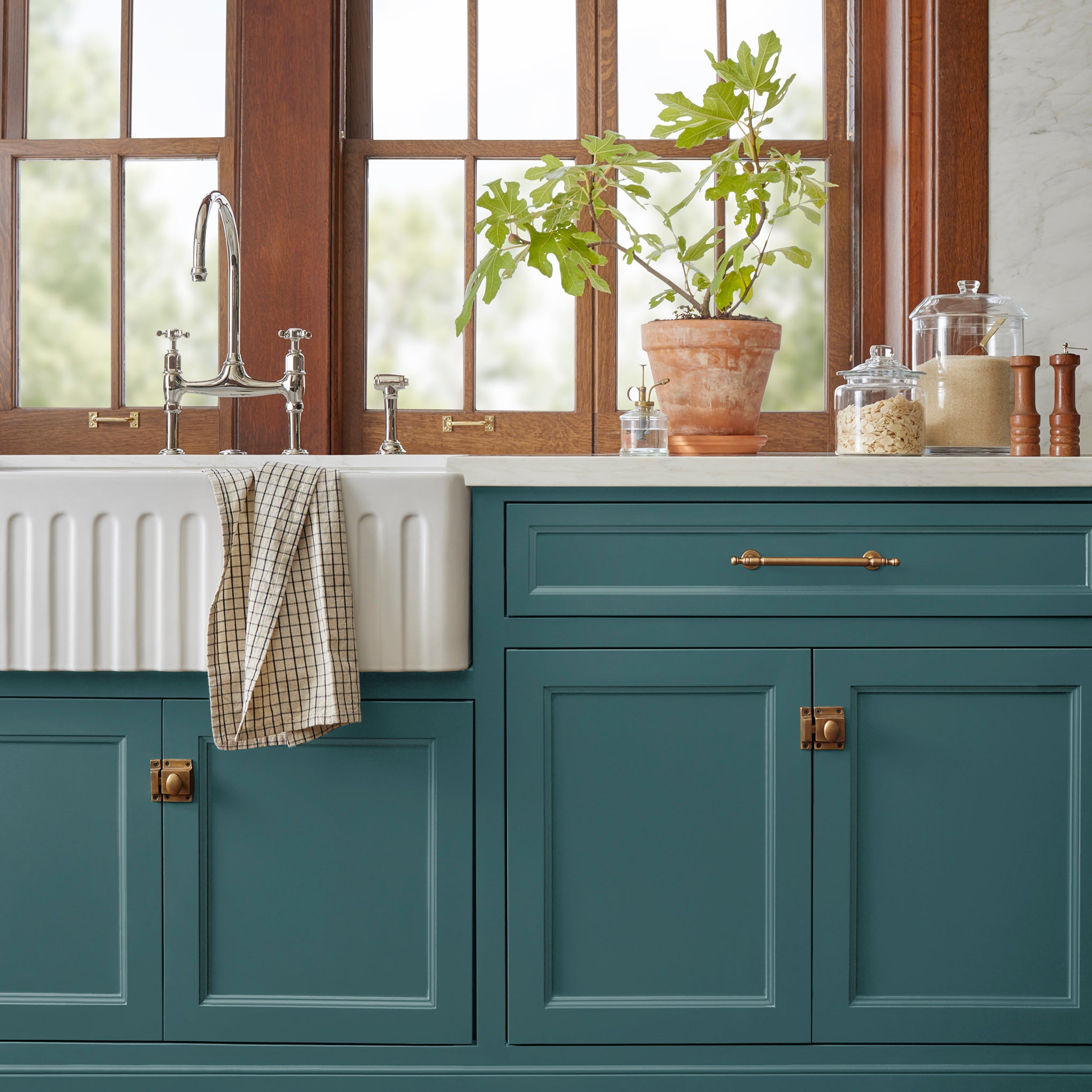 Denim inspired blue paint named weekend shown painted on kitchen cabinet