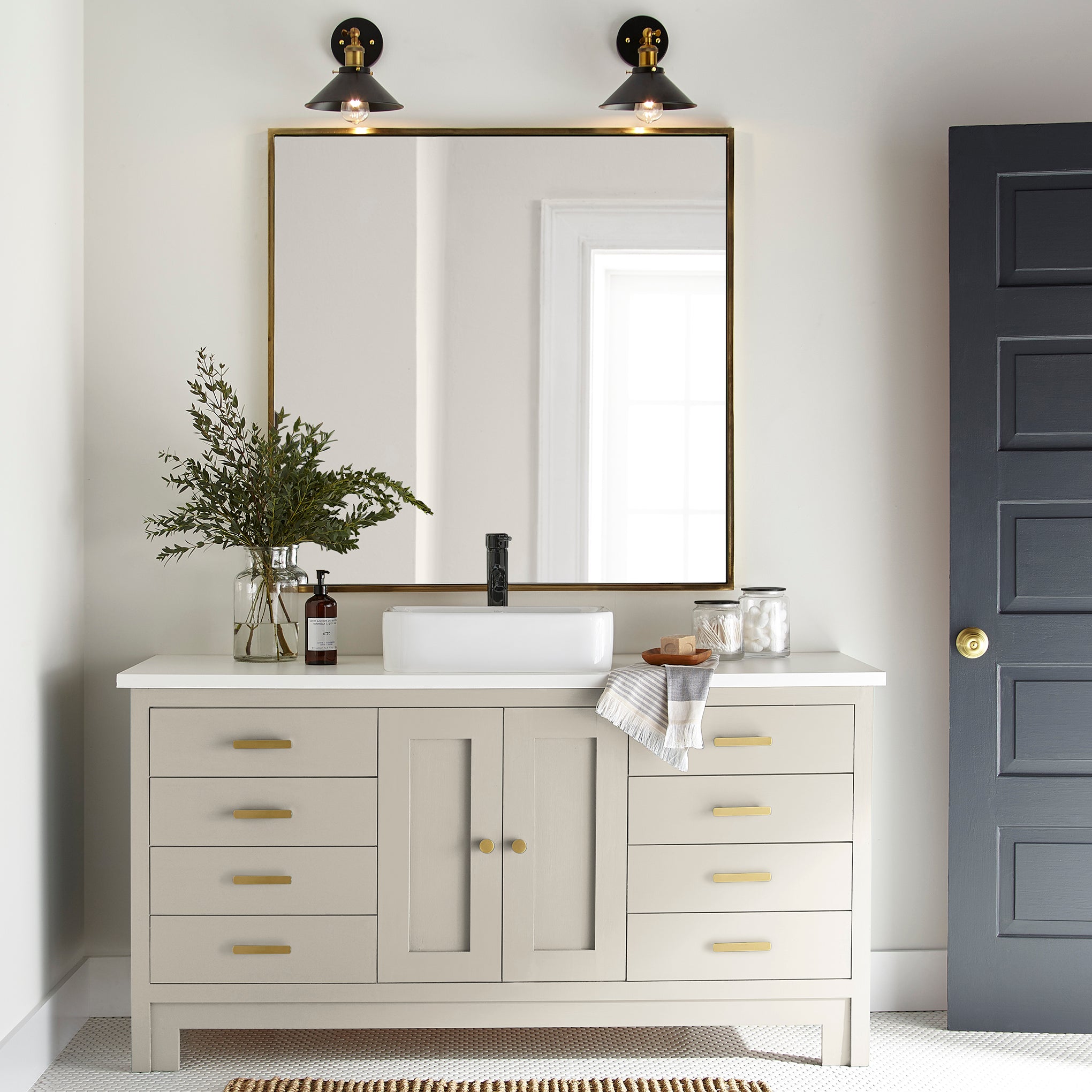 A warm honey yellow interior paint named carter creme shown painted on bathroom cabinet