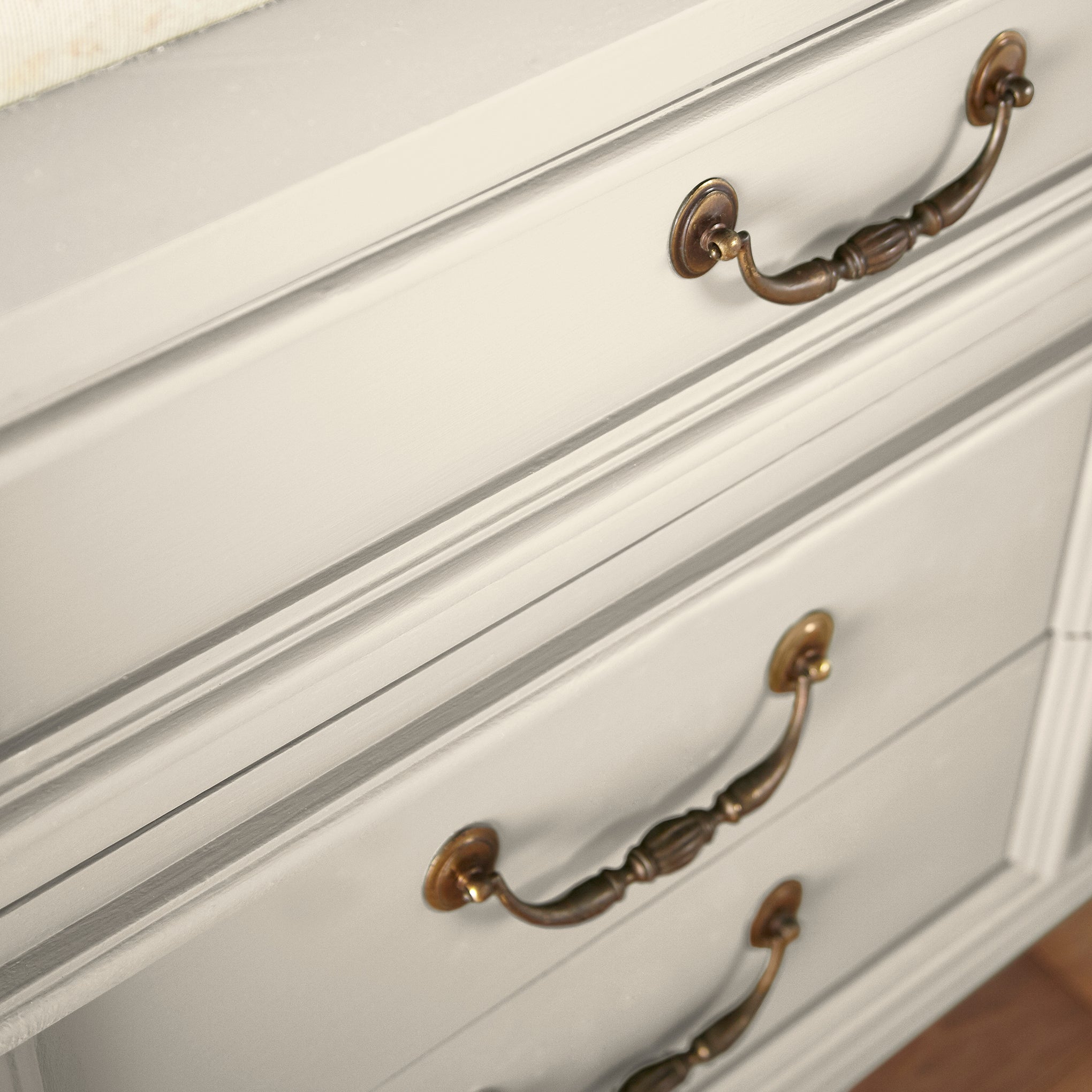 A warm honey yellow interior paint named carter creme shown painted on cabinet