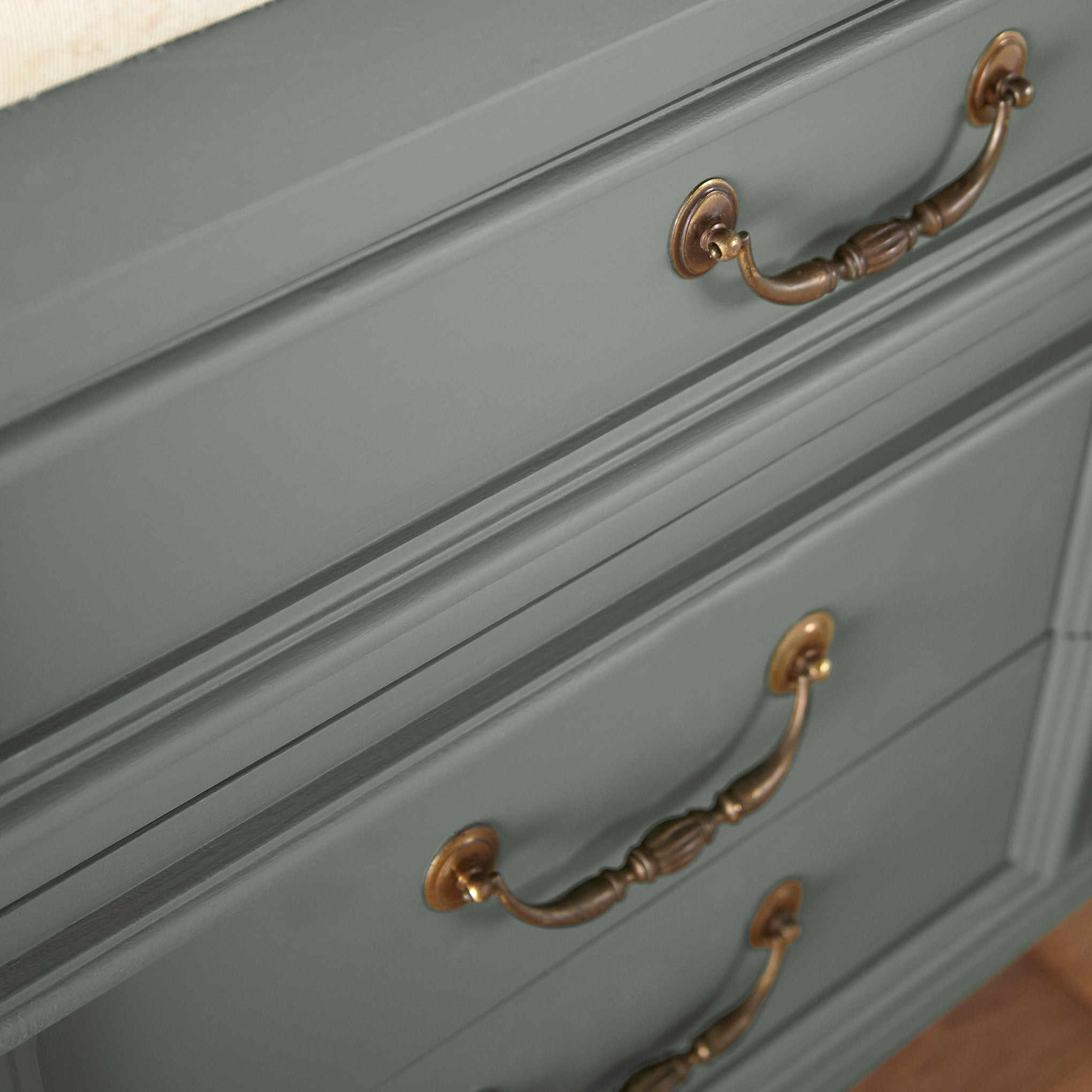 a dark green-grey door and cabinet paint named luxe shown painted on cabinet