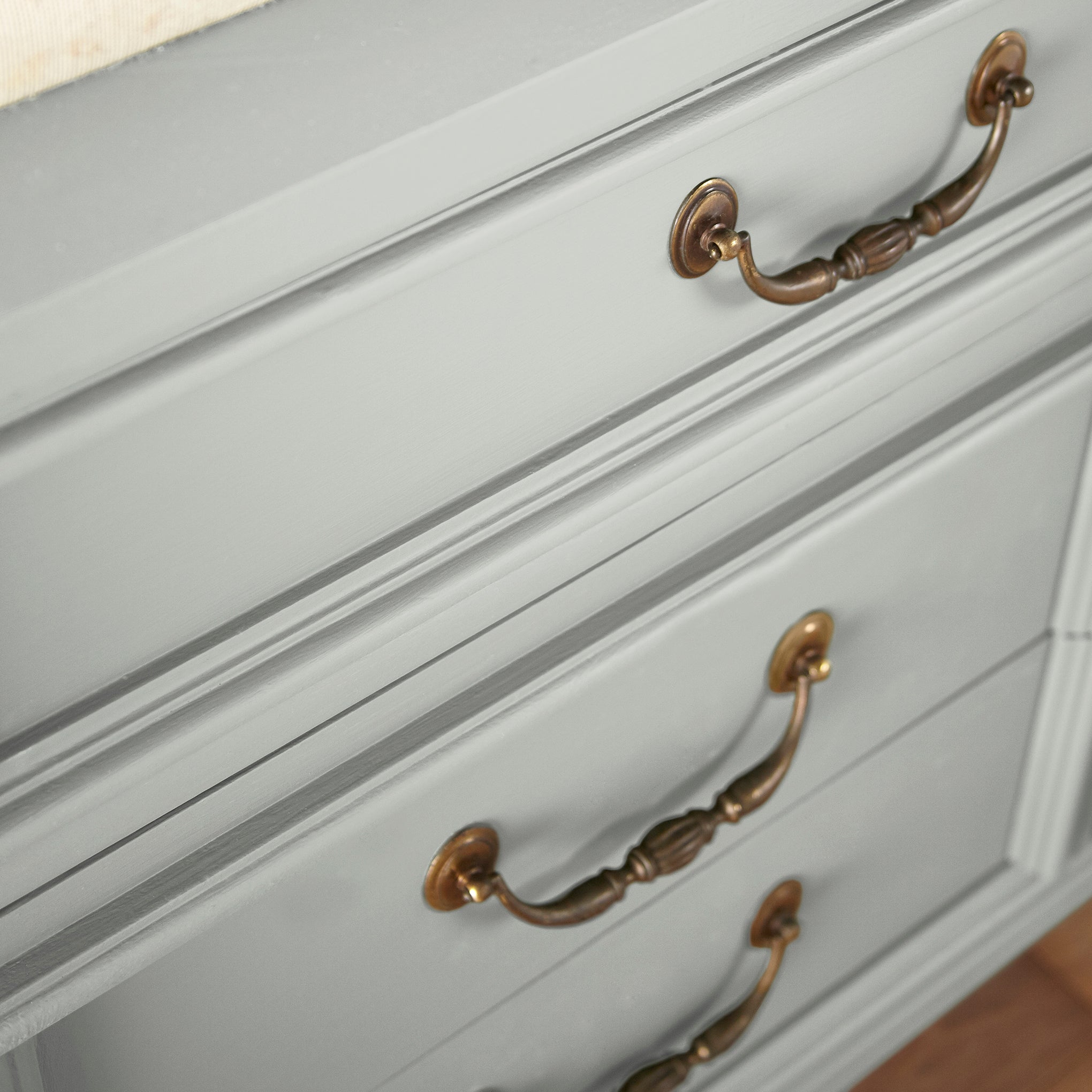 Silver gray tinted with sky blue door and cabinet paint named wedding band shown painted on cabinet