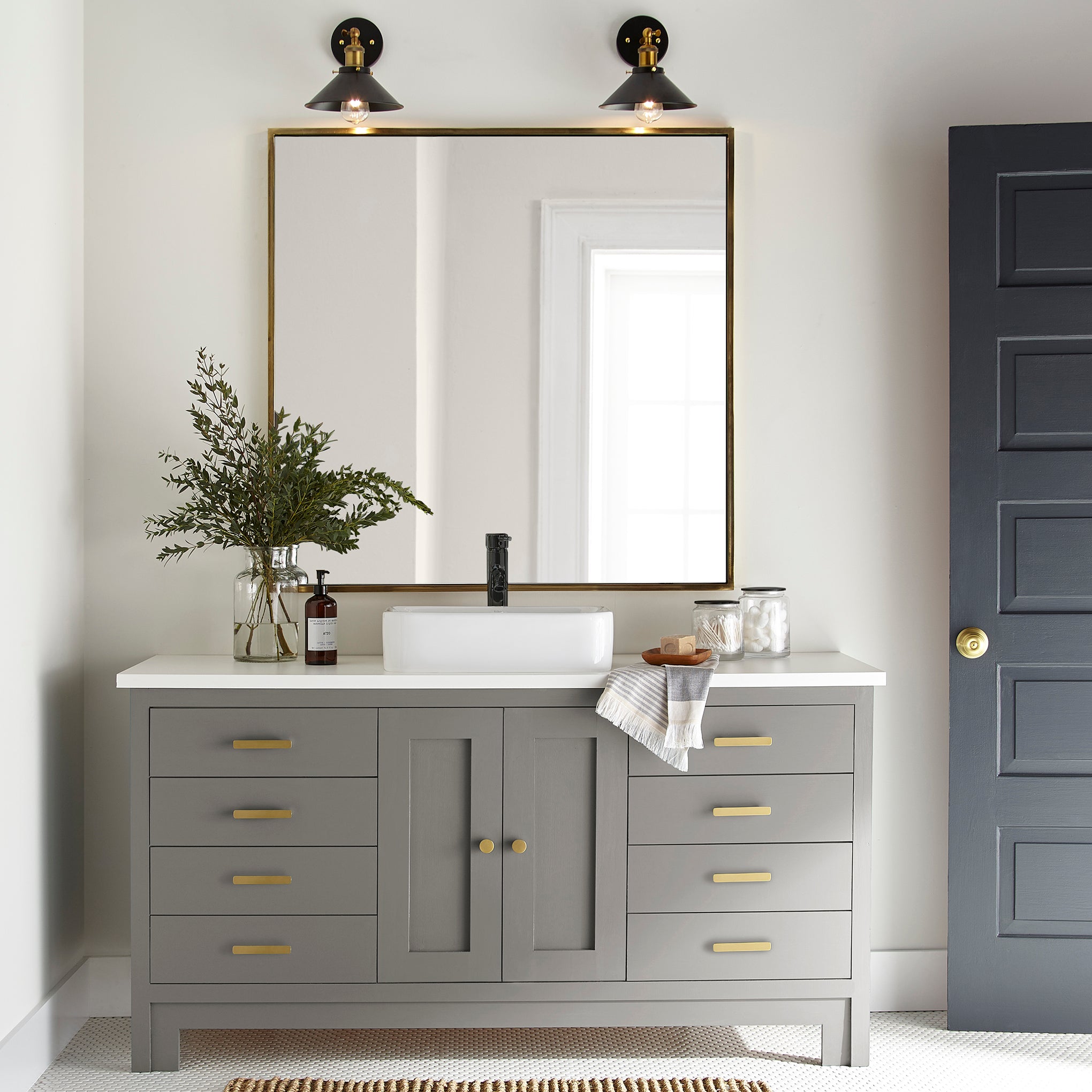 dark grey with olive-brown undertones paint named garden trowel shown painted on bathroom cabinet