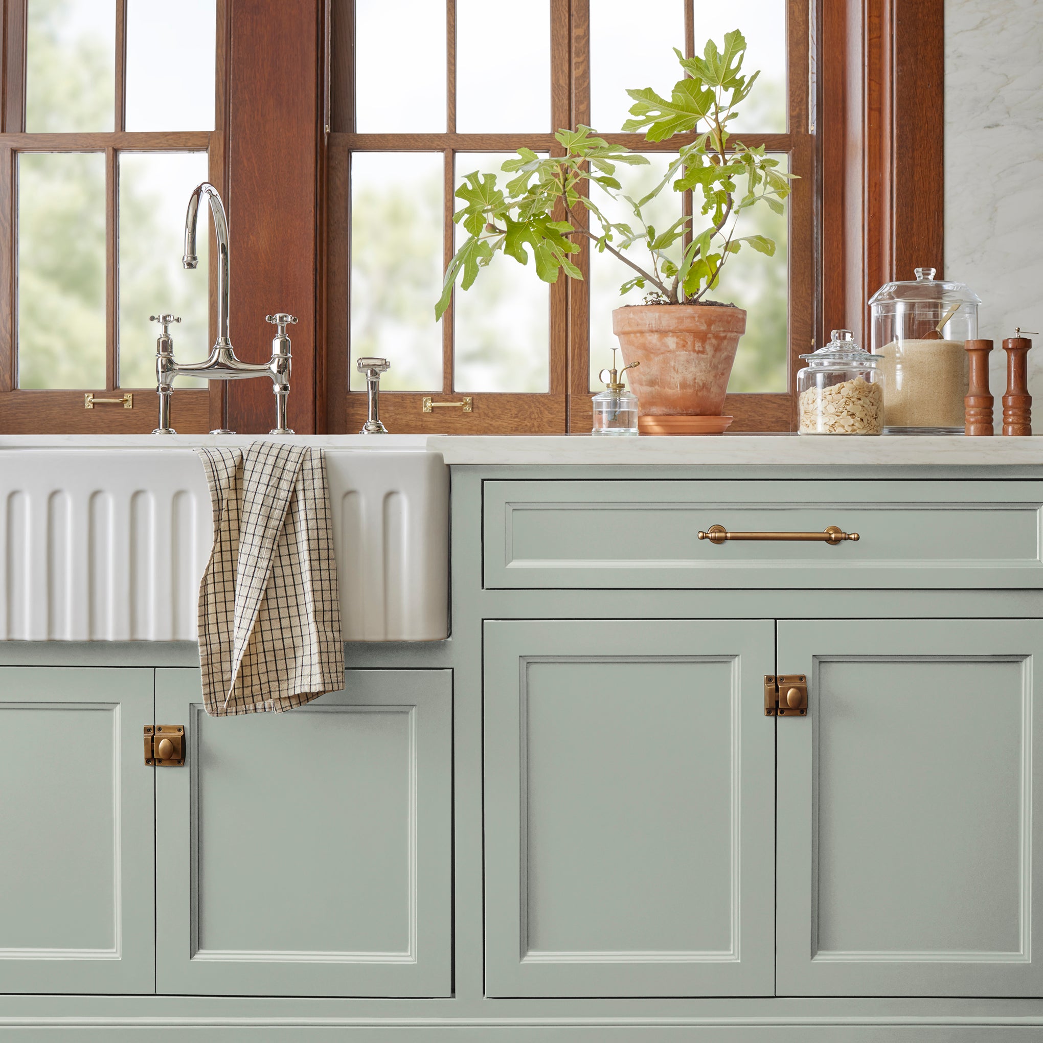 medium grey with cool blue undertones door and cabinet paint named americana egg shown painted on kitchen cabinet
