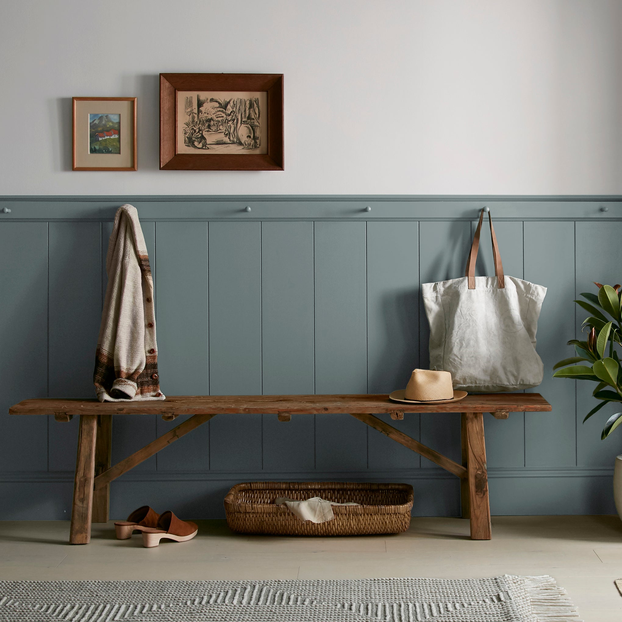 deep muted blue with grey undertones paint named duke gray shown painted on entryway wall