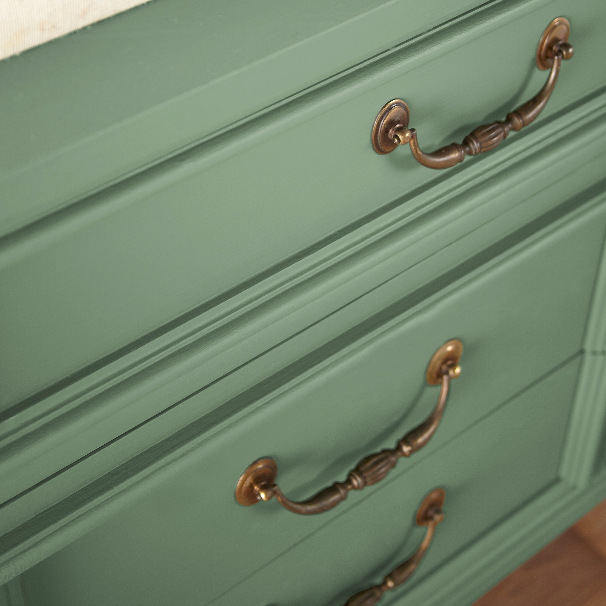 Bold and crisp green trim, door and cabinetry paint named Magnoliass Green shown painted on cabinet