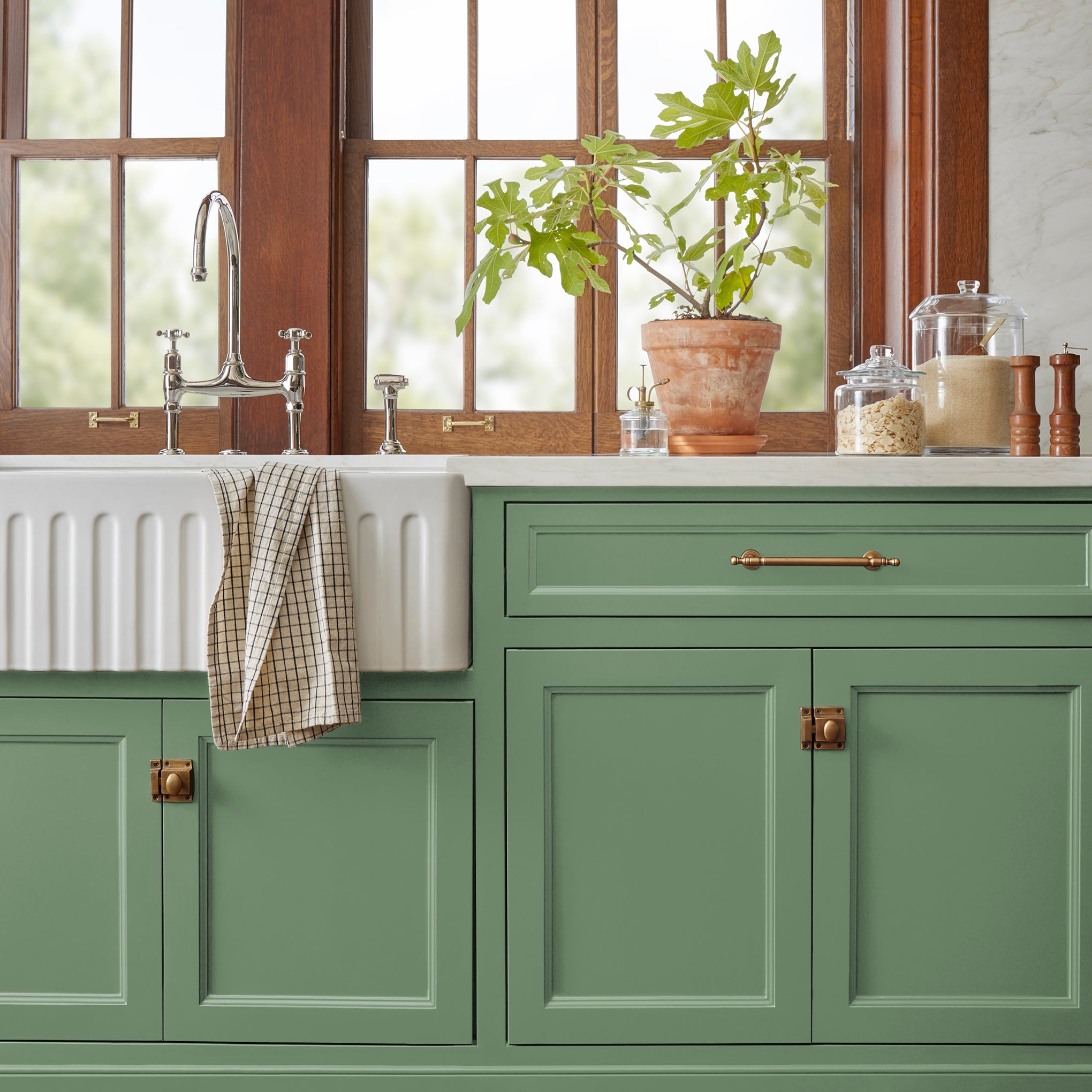 Bold and crisp green trim, door and cabinetry paint named Magnoliass Green shown painted on kitchen cabinet