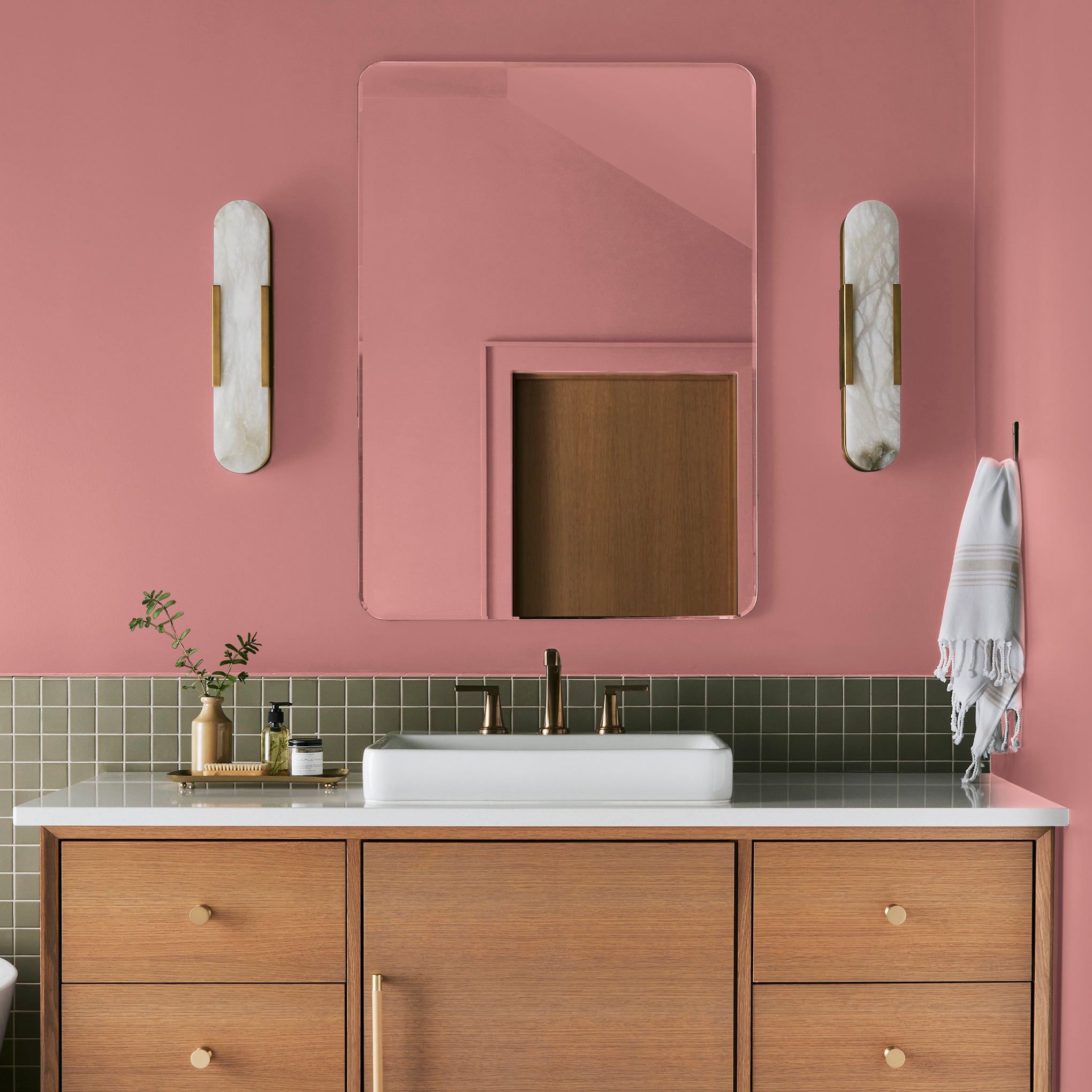 Coral pink interior paint named pink lemonade shown painted on bathroom wall