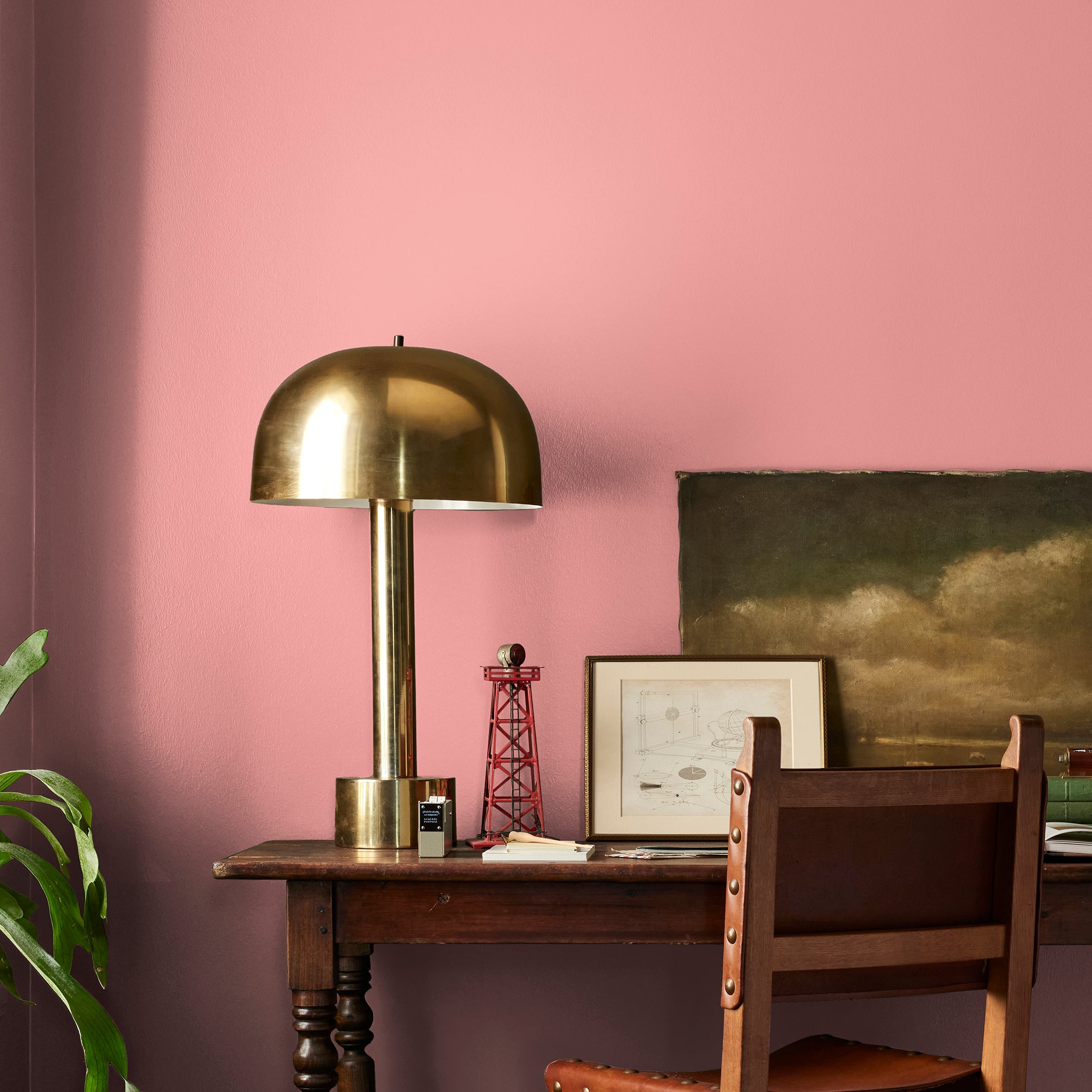 Coral pink interior paint named pink lemonade shown painted on bedroom wall